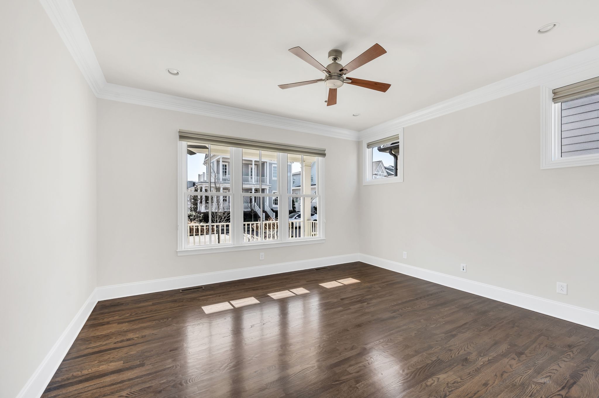 2000 Erwin Street Franklin, TN 37064 - Photo 17 of 97 a view of an empty room with wooden floor and a window