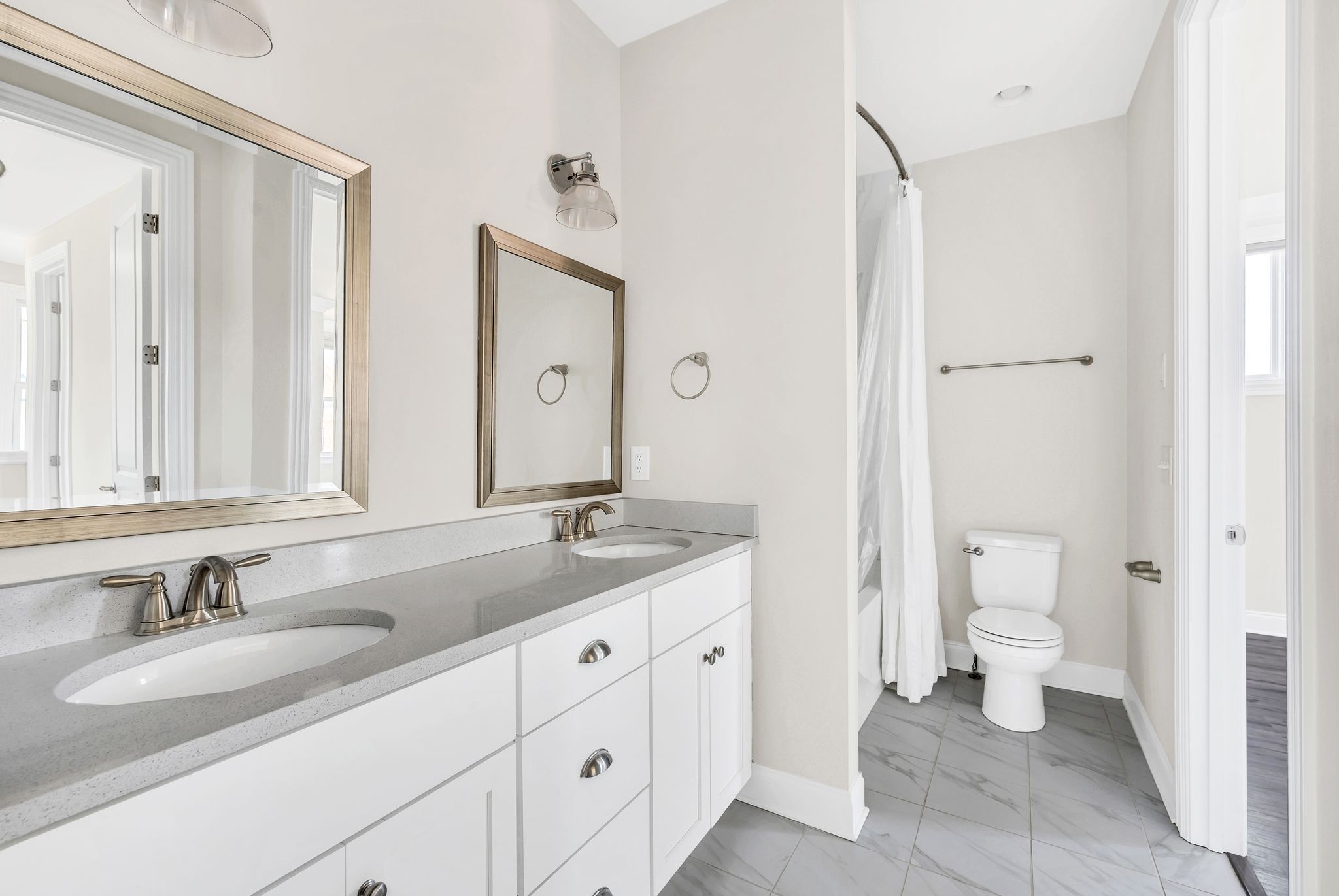 2000 Erwin Street Franklin, TN 37064 - Photo 29 of 97 a bathroom with a granite countertop sink and a mirror