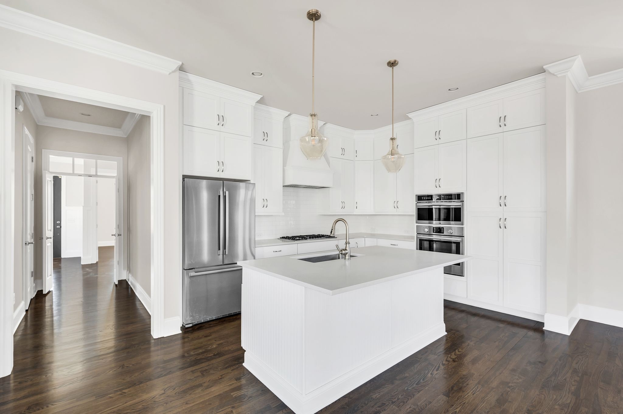 2000 Erwin Street Franklin, TN 37064 - Photo 8 of 97 a kitchen with stainless steel appliances granite countertop a refrigerator a sink a stove and white cabinets with wooden floor