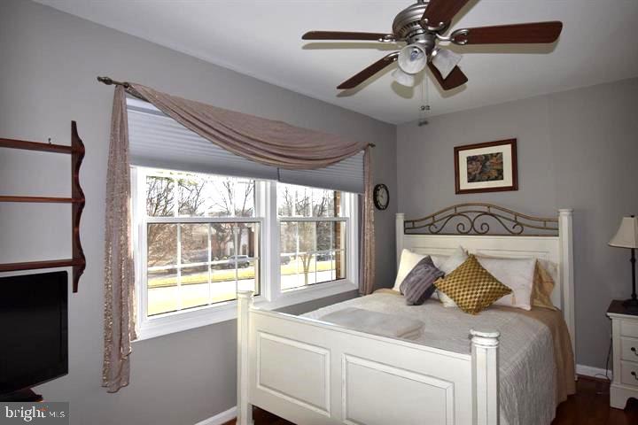 8244 Carrleigh Parkway Springfield, VA 22152 - Photo 15 of 25 a bedroom with a bed and a window