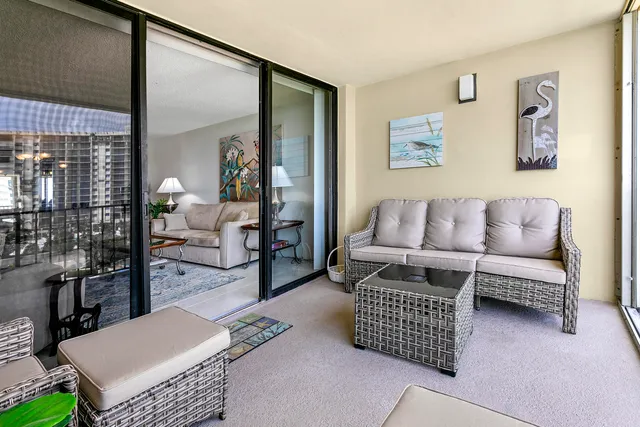 a living room with furniture rug and window