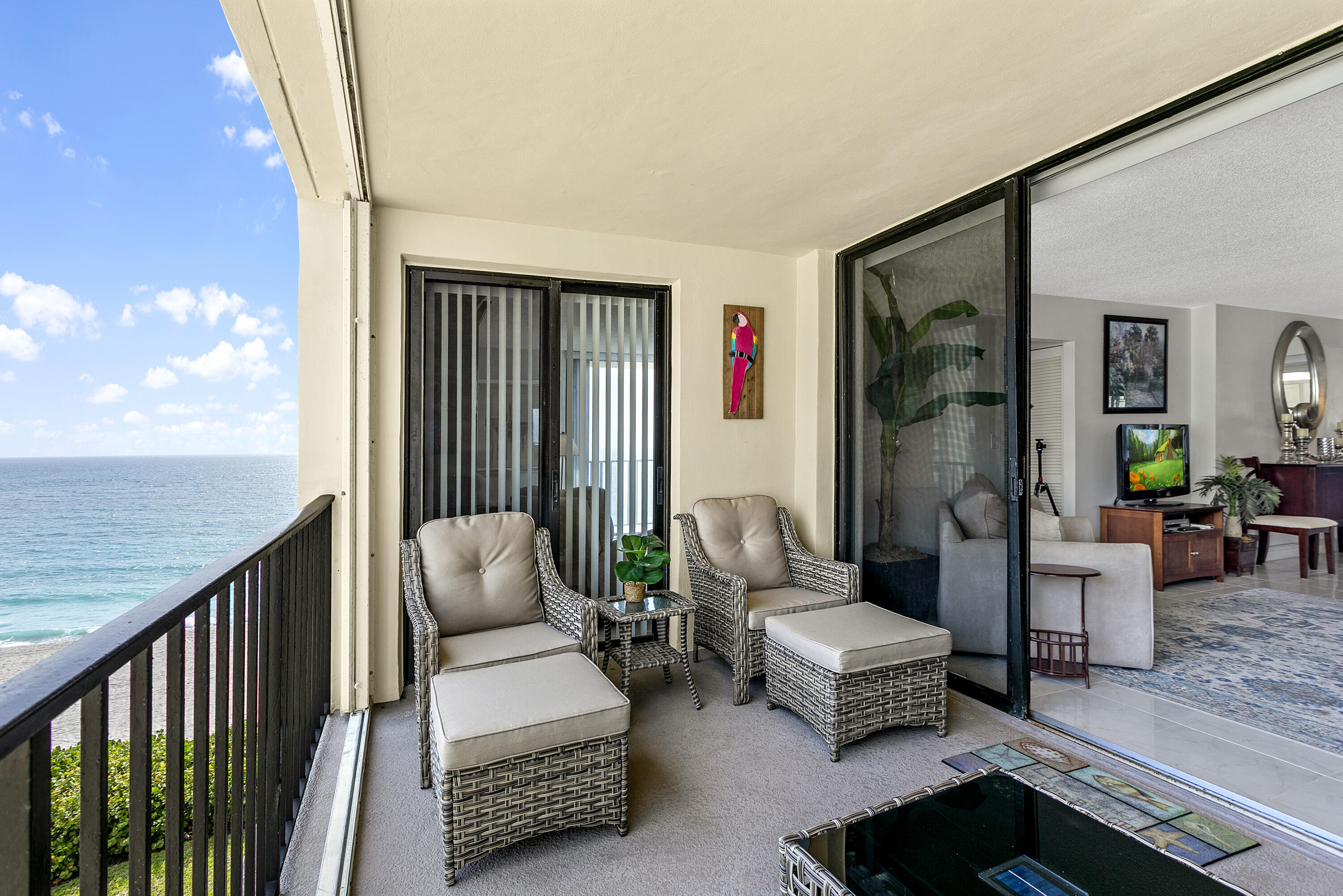 100 Ocean Trail Way, Unit 501 Jupiter, FL 33477 - Photo 21 of 30 a balcony with furniture and garden view