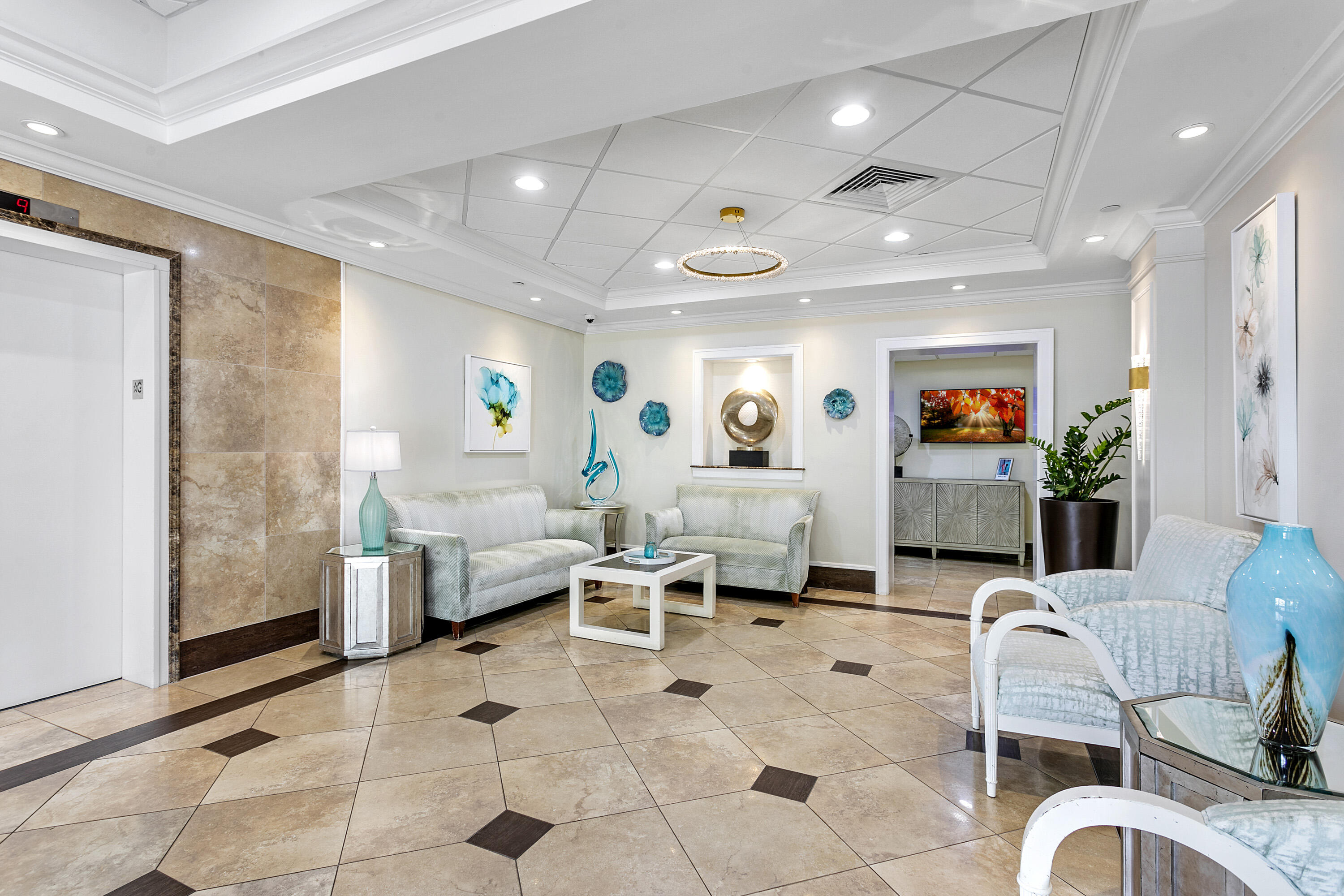 100 Ocean Trail Way, Unit 501 Jupiter, FL 33477 - Photo 23 of 30 a living room with furniture and a flat screen tv