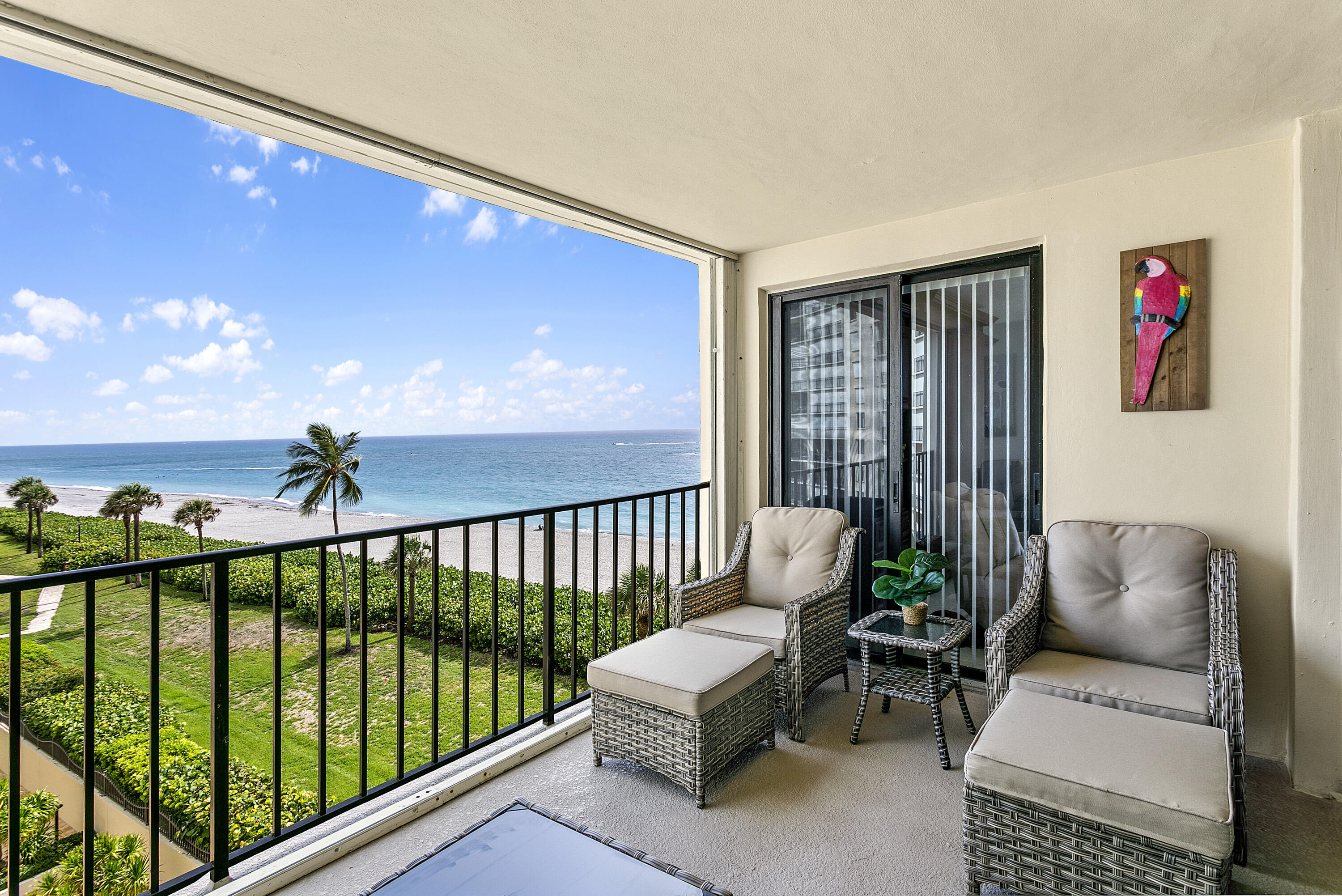 100 Ocean Trail Way, Unit 501 Jupiter, FL 33477 - Photo 3 of 30 a balcony with furniture and a potted plant