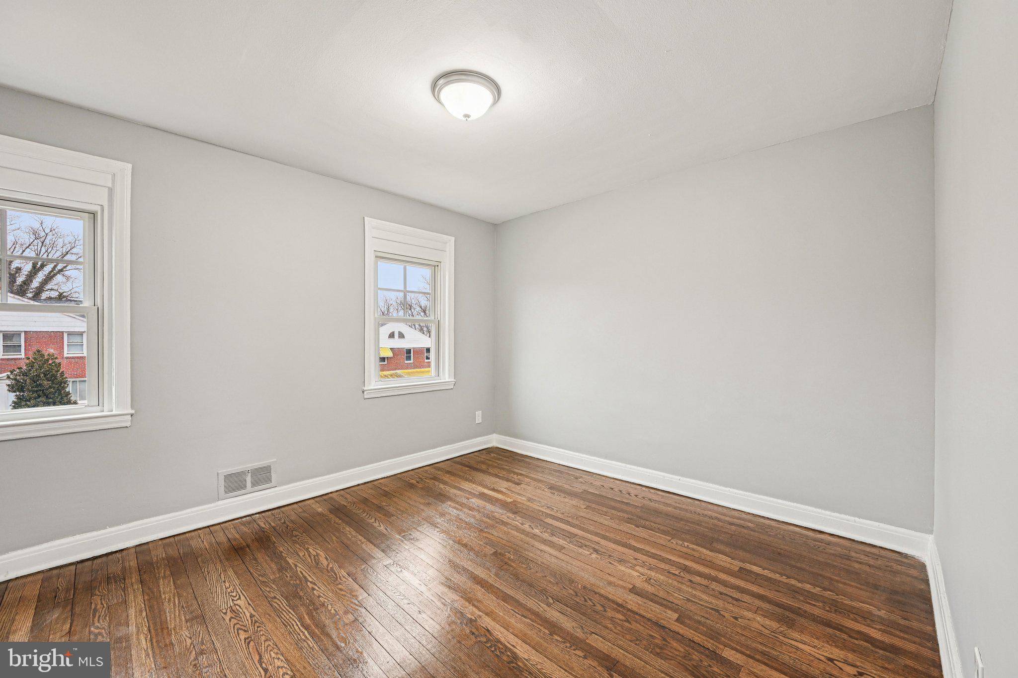 38 Upmanor Road Baltimore, MD 21229 - Photo 13 of 35 a view of room with wooden floor and window