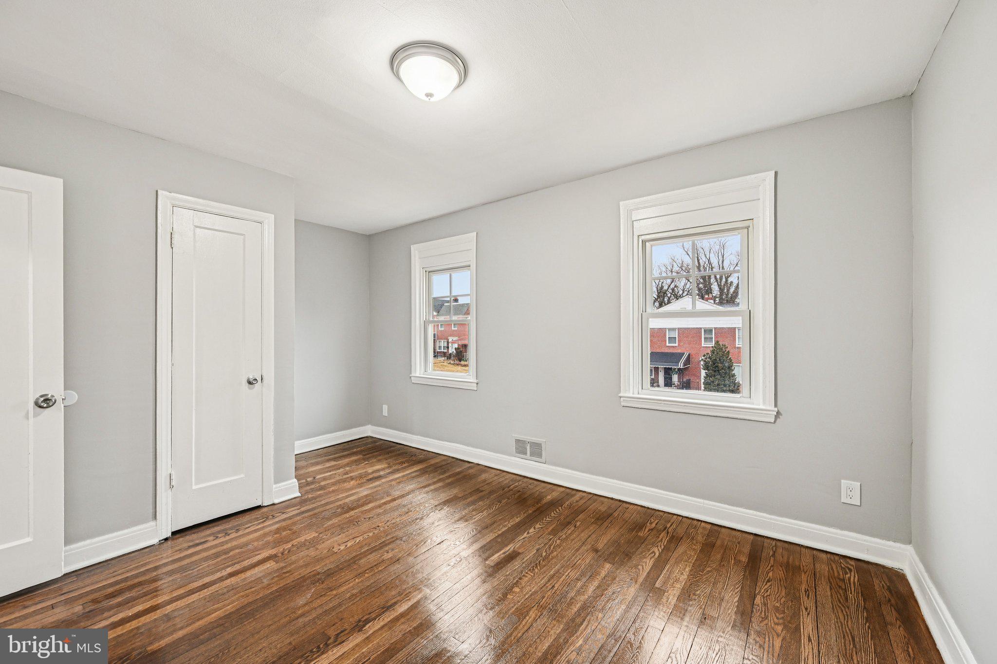 38 Upmanor Road Baltimore, MD 21229 - Photo 14 of 35 wooden floor in an empty room with a window
