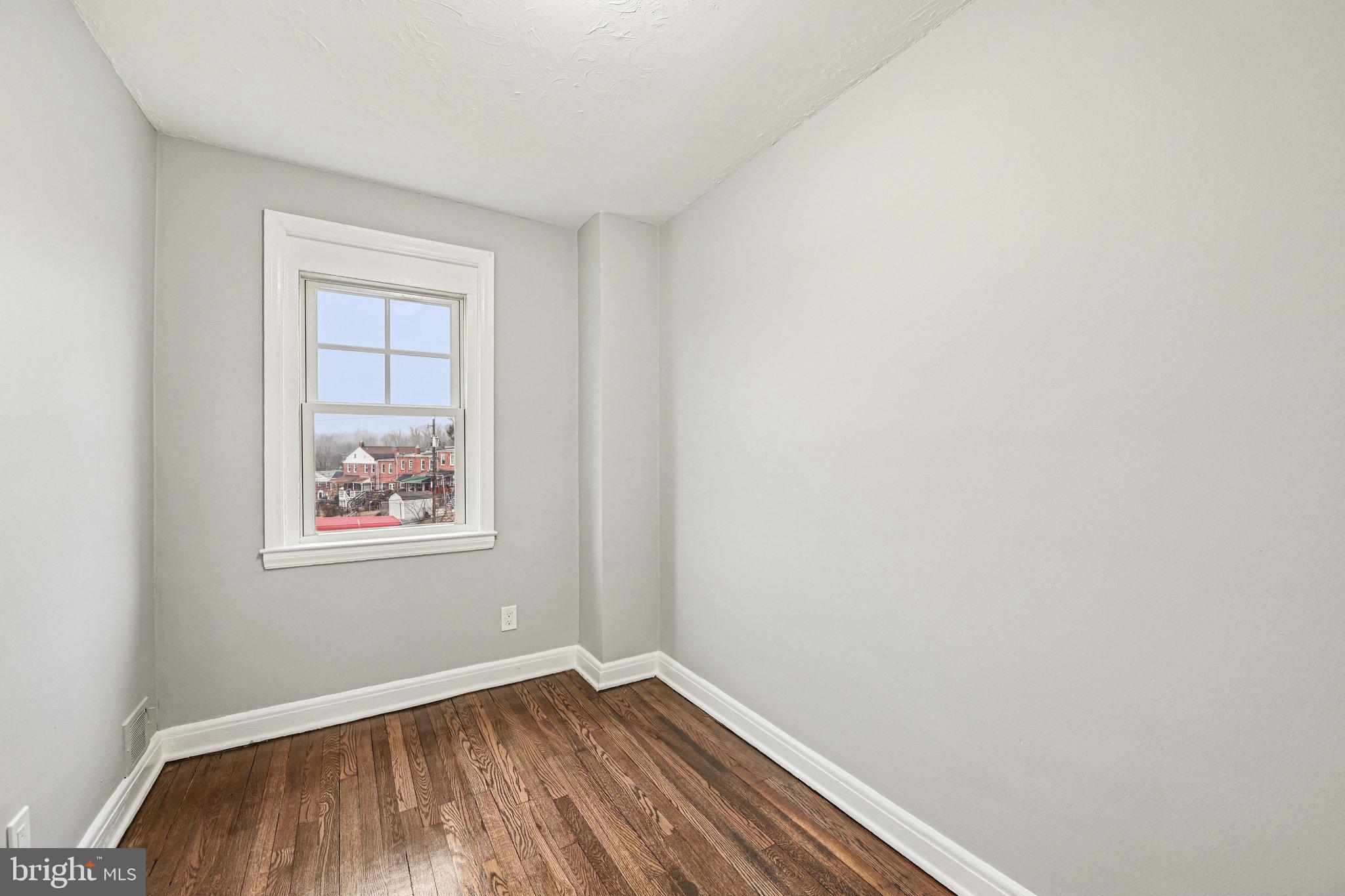 38 Upmanor Road Baltimore, MD 21229 - Photo 17 of 35 an empty room with a window