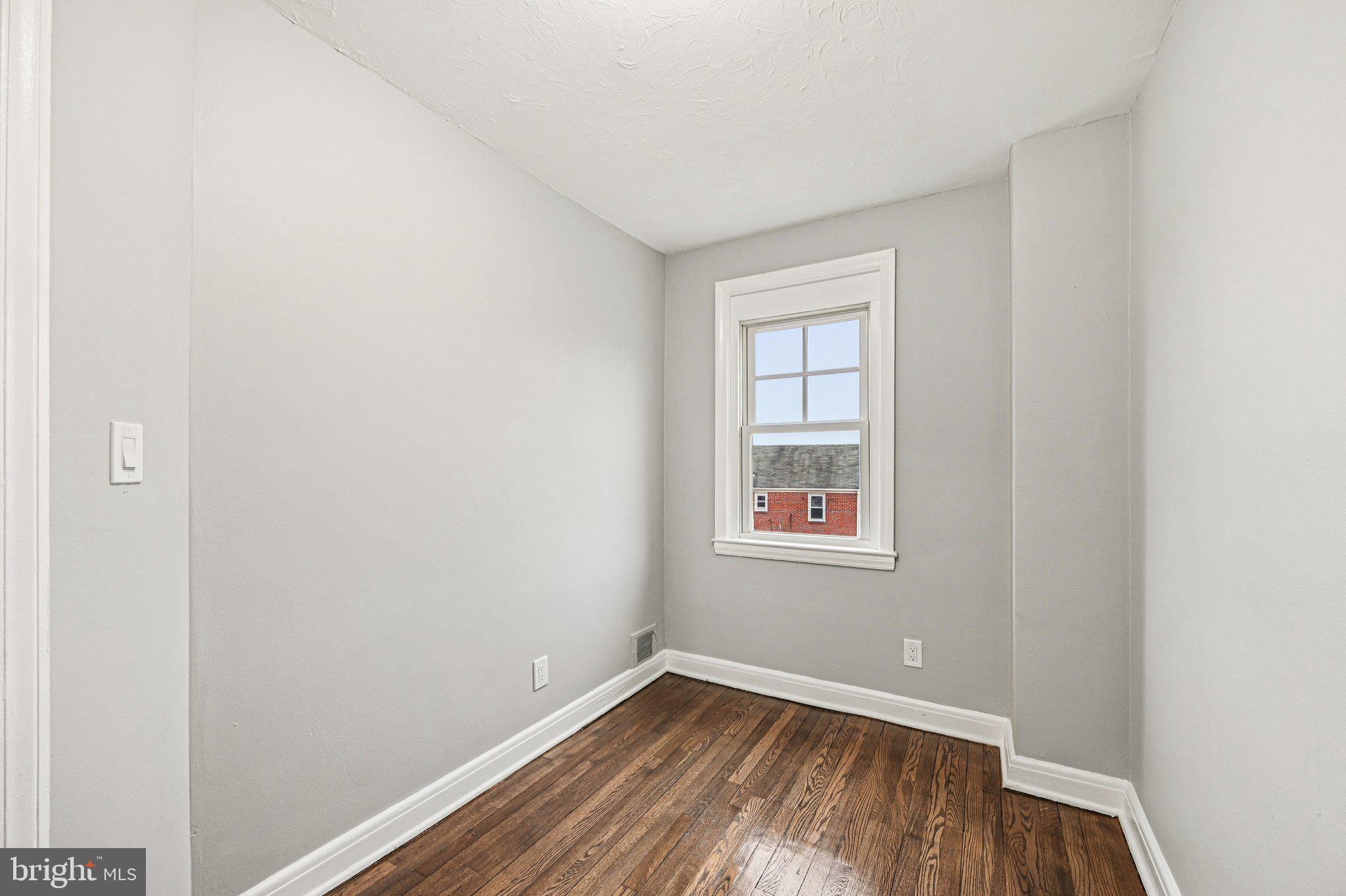38 Upmanor Road Baltimore, MD 21229 - Photo 18 of 35 an empty room with a window