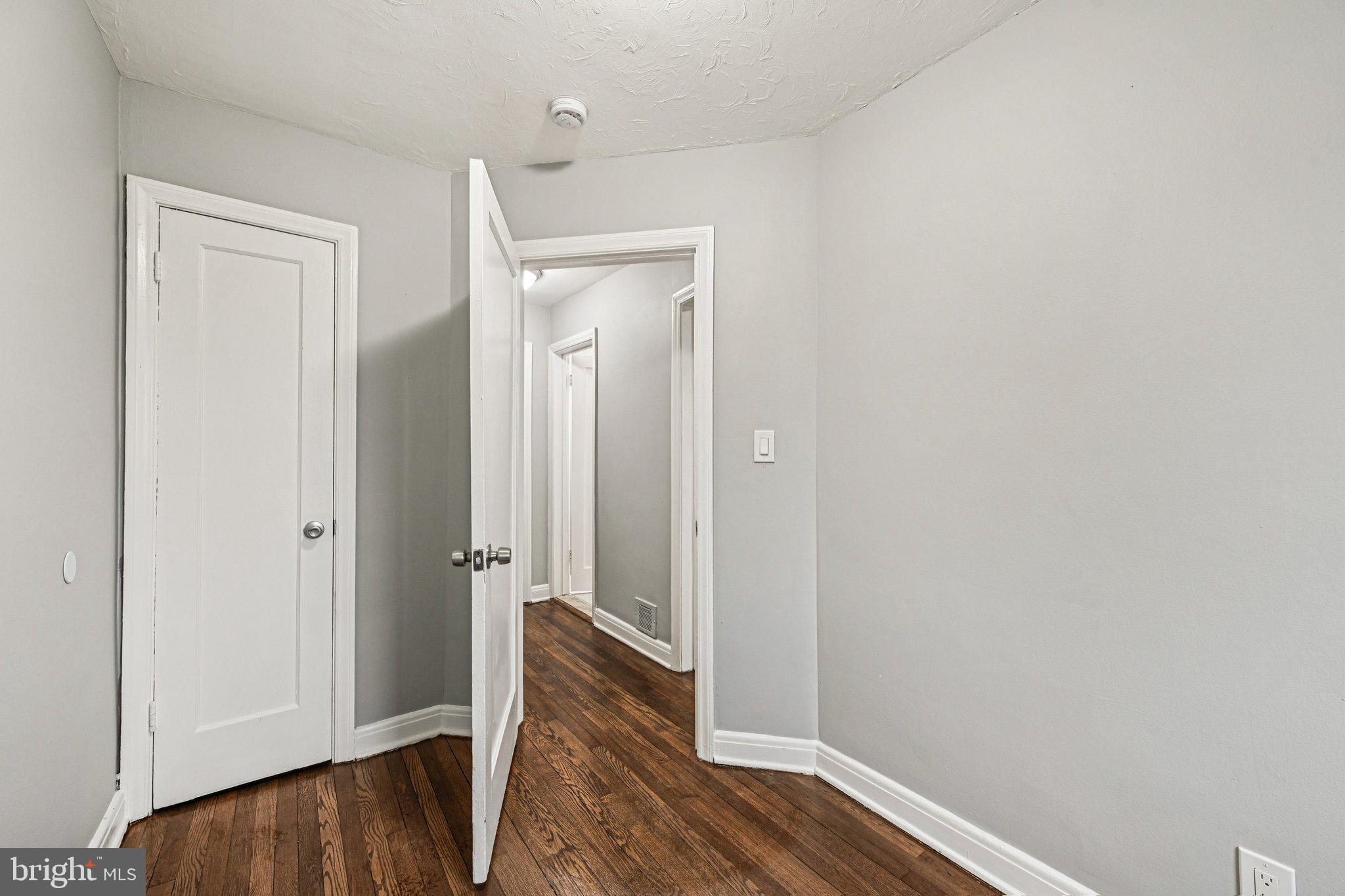 38 Upmanor Road Baltimore, MD 21229 - Photo 19 of 35 an empty room with wooden floor and closet