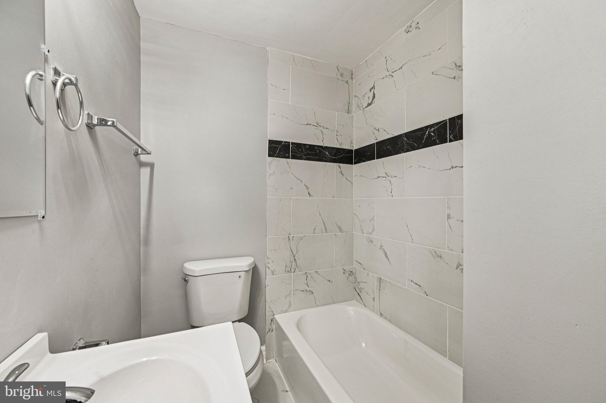 38 Upmanor Road Baltimore, MD 21229 - Photo 20 of 35 a bathroom with a bathtub and shower