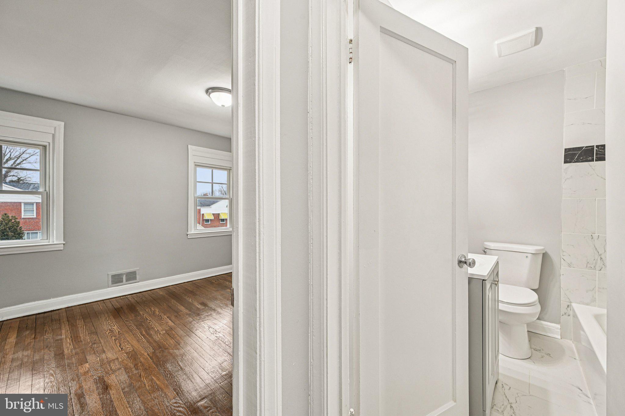 38 Upmanor Road Baltimore, MD 21229 - Photo 21 of 35 a bathroom with a toilet and a shower