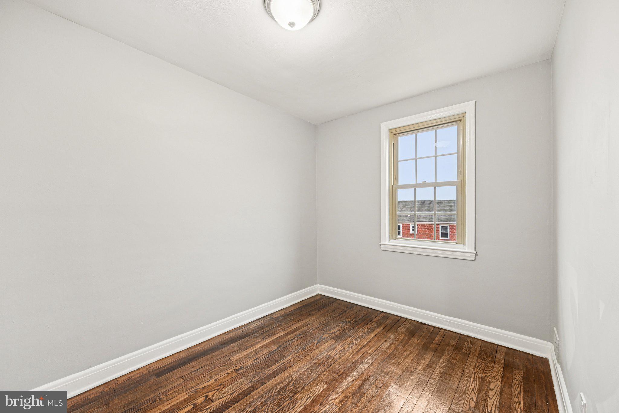 38 Upmanor Road Baltimore, MD 21229 - Photo 22 of 35 an empty room with a window