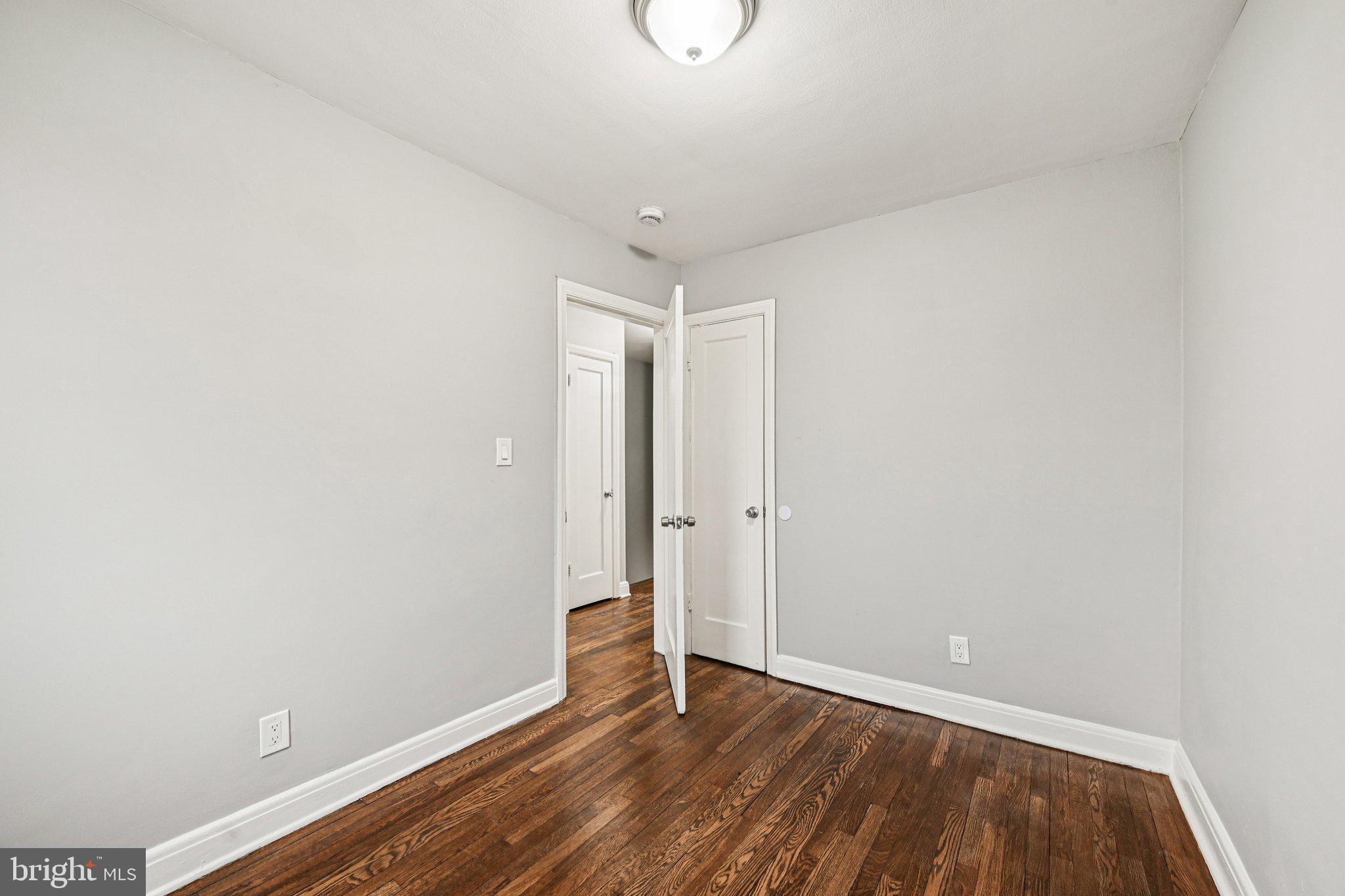 38 Upmanor Road Baltimore, MD 21229 - Photo 24 of 35 a view of a room with wooden floor and white walls
