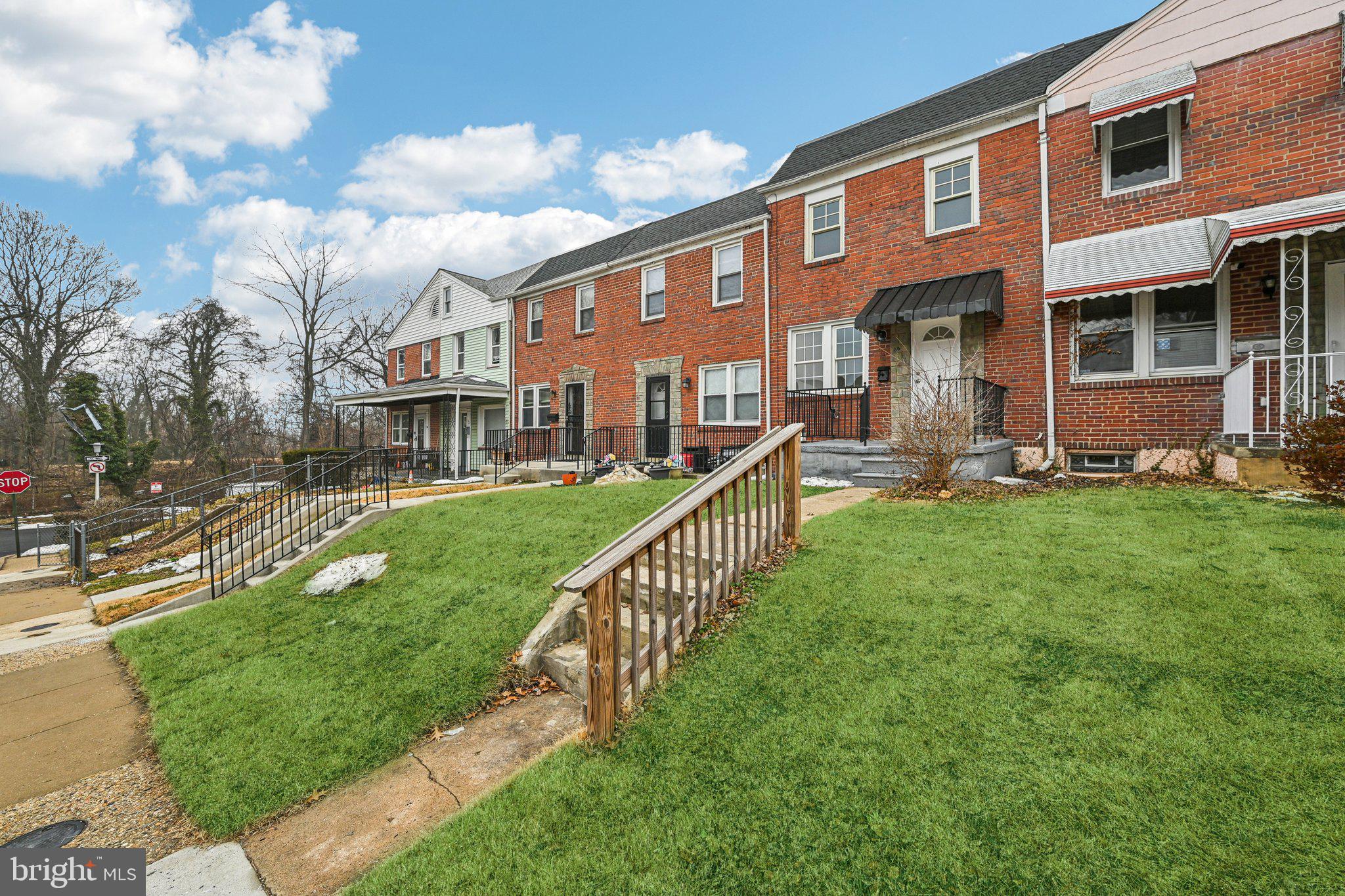 38 Upmanor Road Baltimore, MD 21229 - Photo 35 of 35 a front view of a house with a yard table and chairs