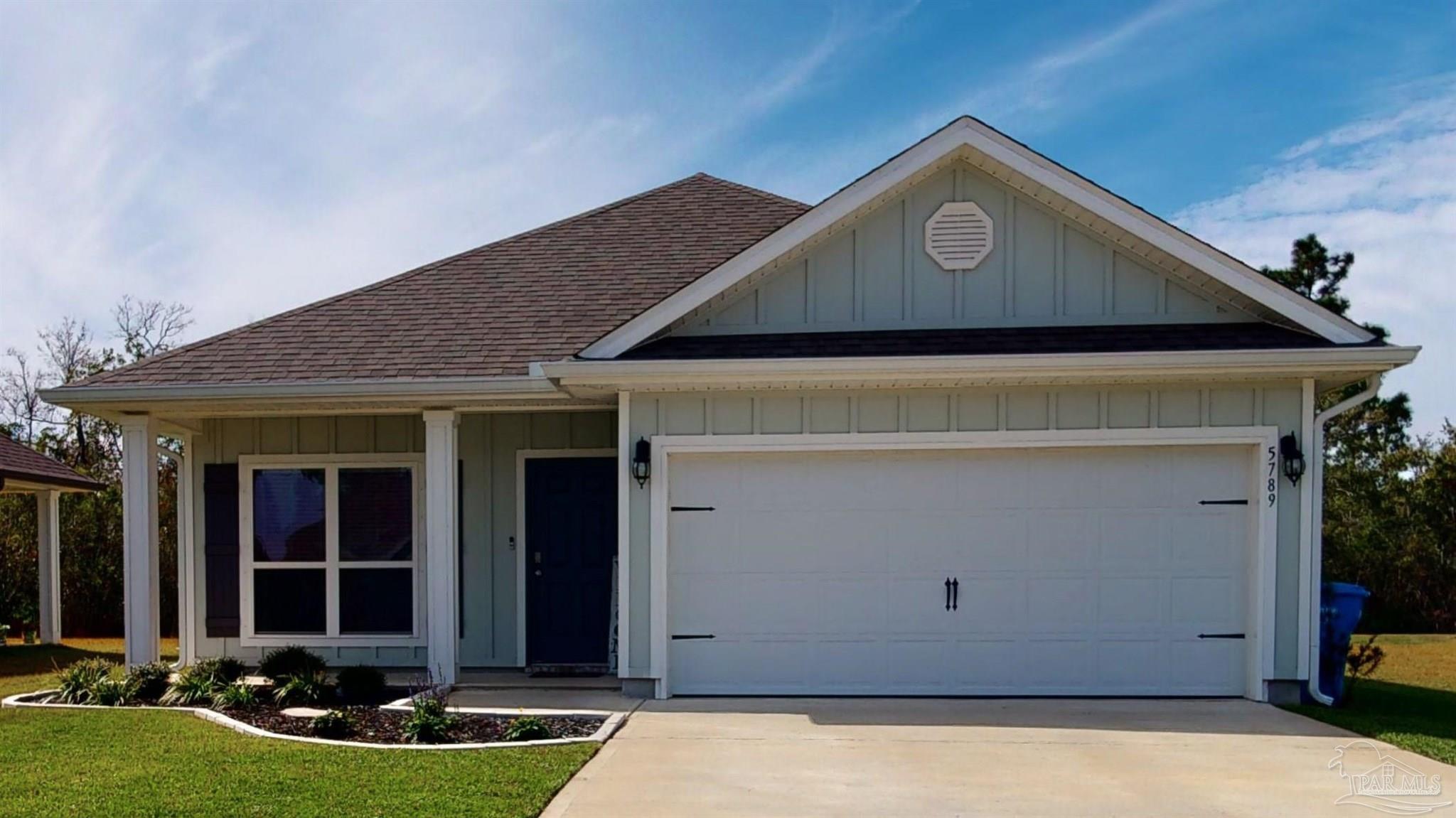 a front view of house with yard
