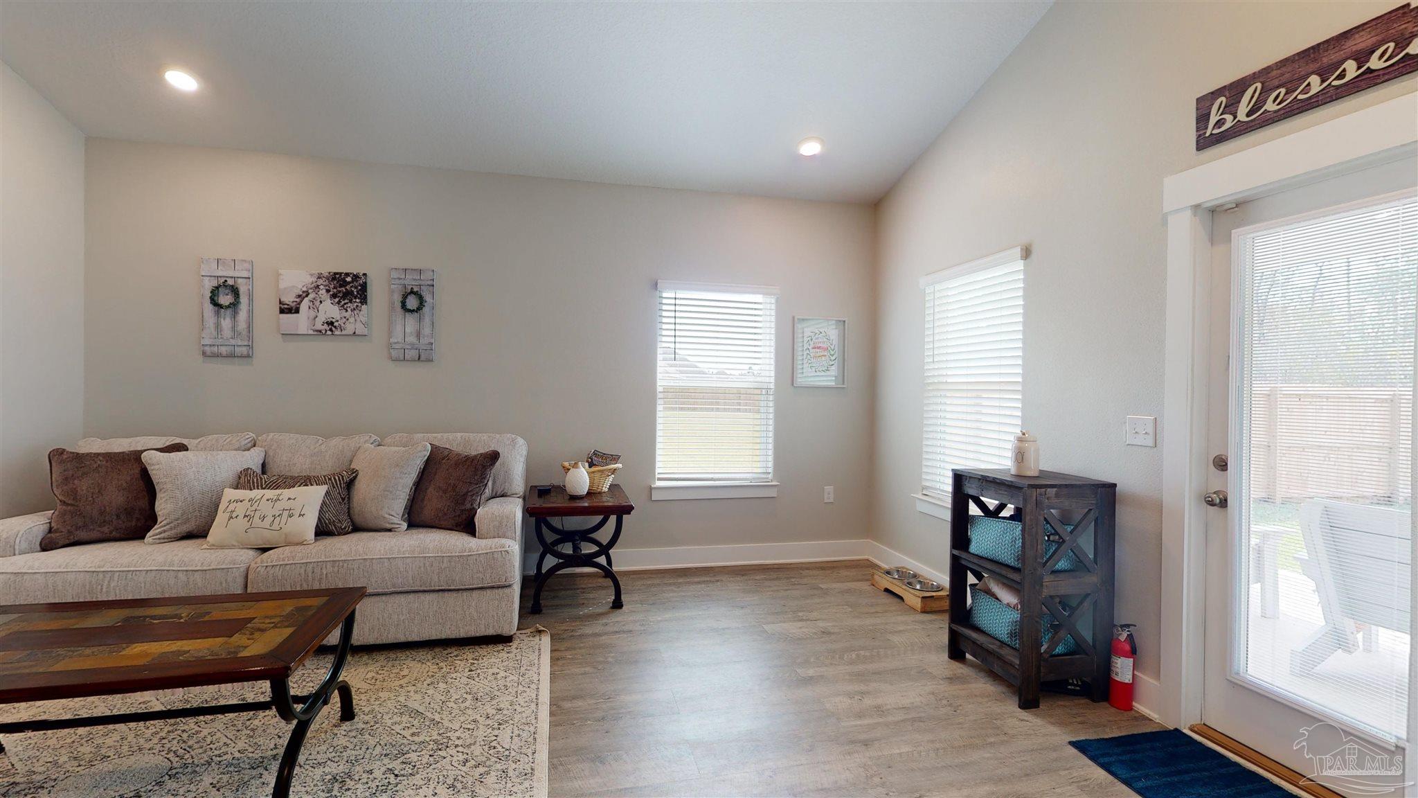 5789 Conley Court Milton, FL 32571 - Photo 11 of 50 a living room with furniture and a window
