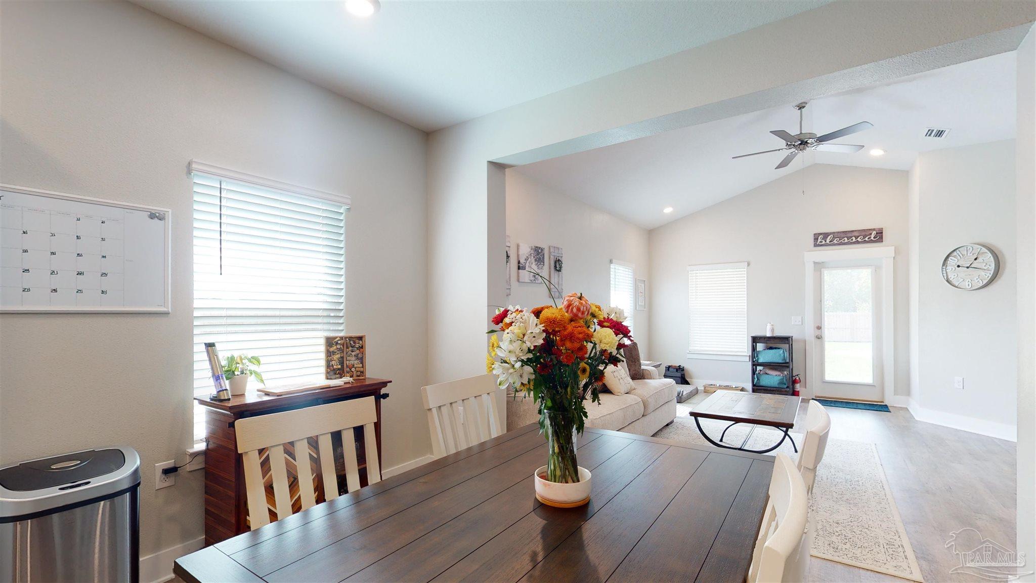5789 Conley Court Milton, FL 32571 - Photo 17 of 50 a living room with furniture and wooden floor