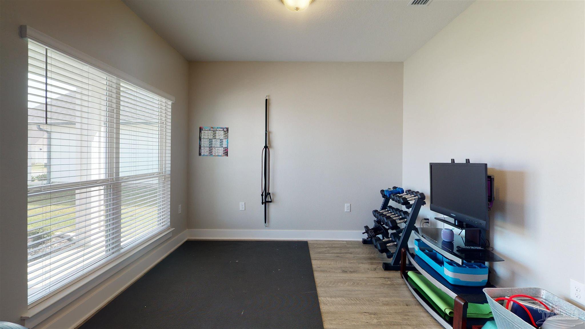 5789 Conley Court Milton, FL 32571 - Photo 22 of 50 a room with furniture and a window