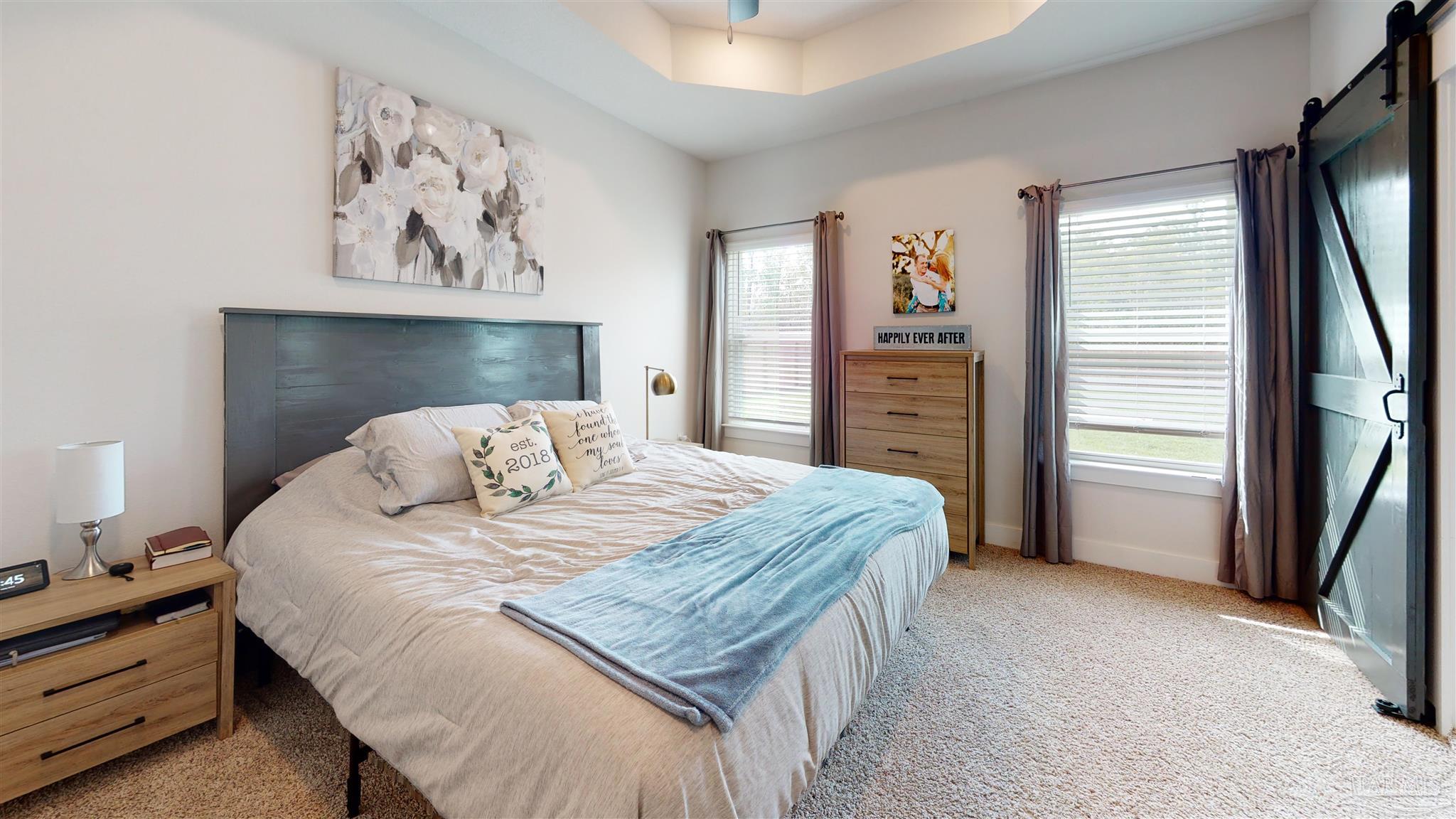 5789 Conley Court Milton, FL 32571 - Photo 24 of 50 a bedroom with a large bed and a window