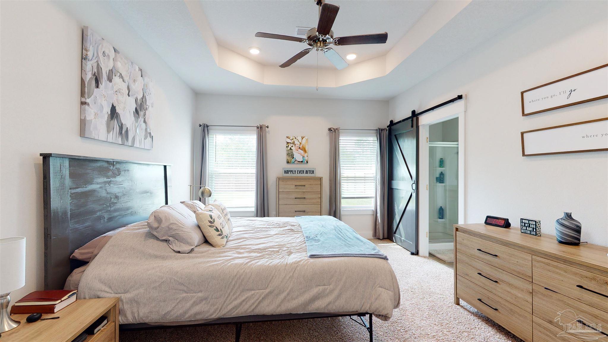 5789 Conley Court Milton, FL 32571 - Photo 25 of 50 a bedroom with a bed and a dresser