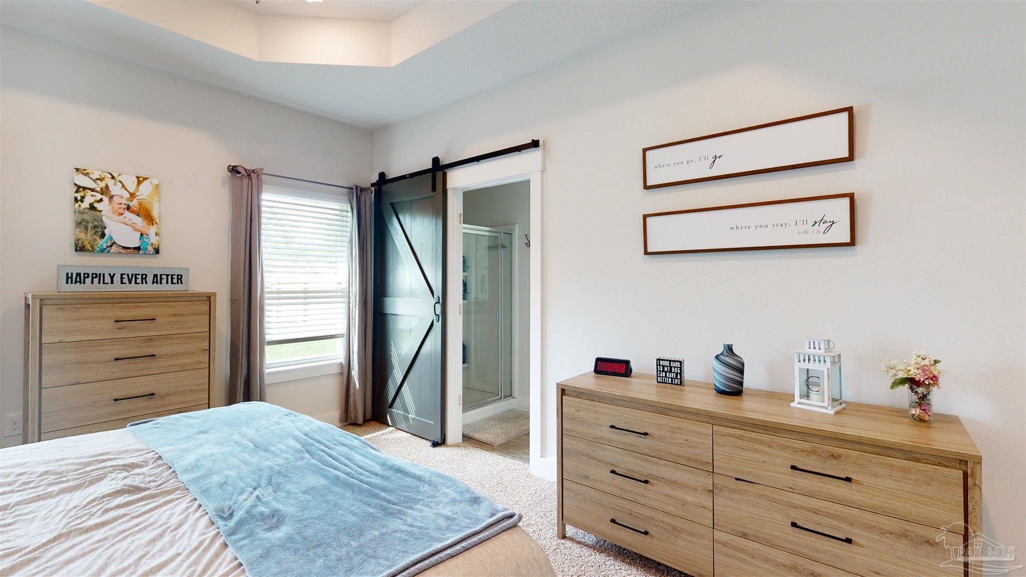 5789 Conley Court Milton, FL 32571 - Photo 26 of 50 a bedroom with a bed and a dresser