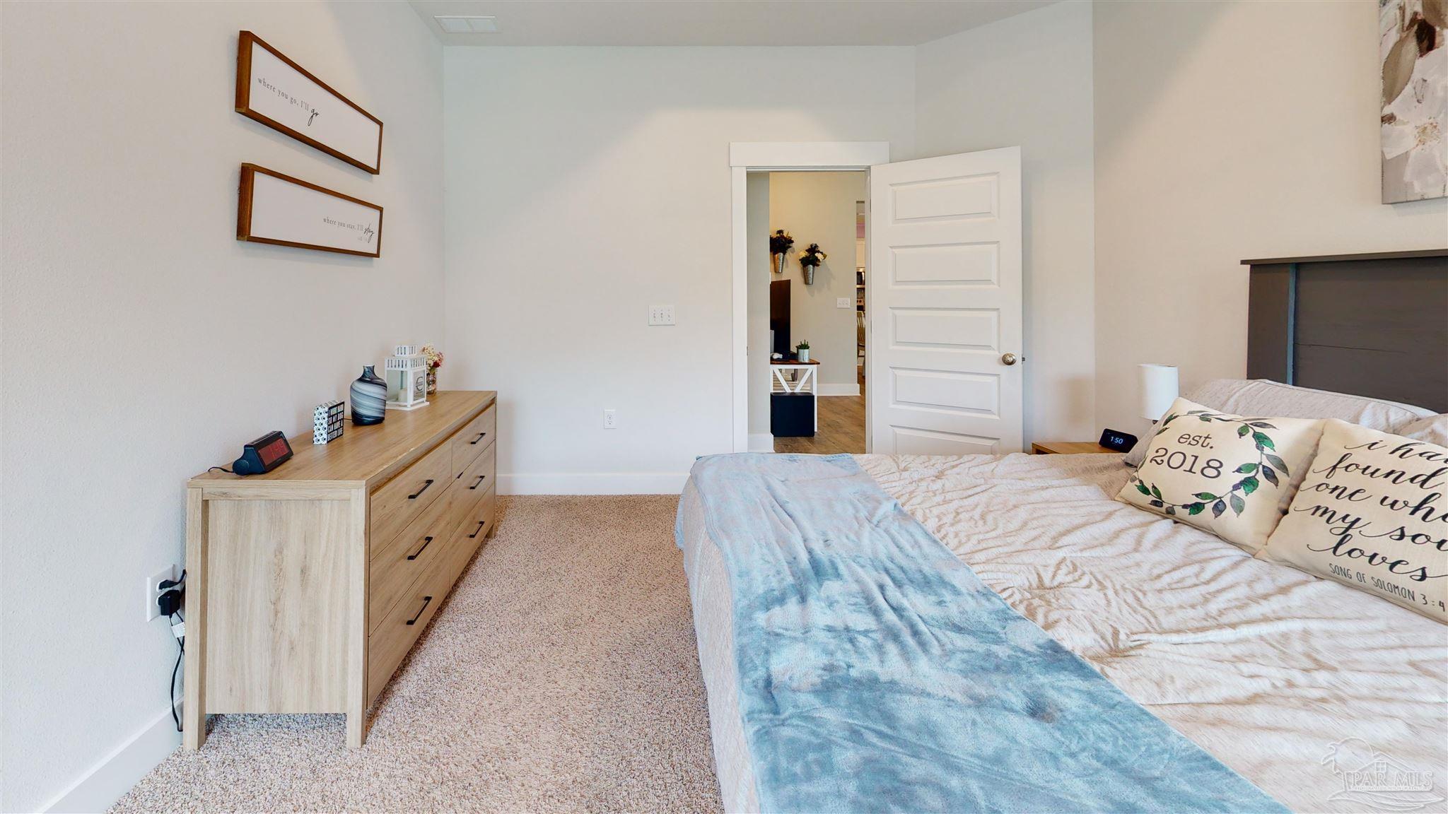 5789 Conley Court Milton, FL 32571 - Photo 29 of 50 a bedroom with a bed and a window