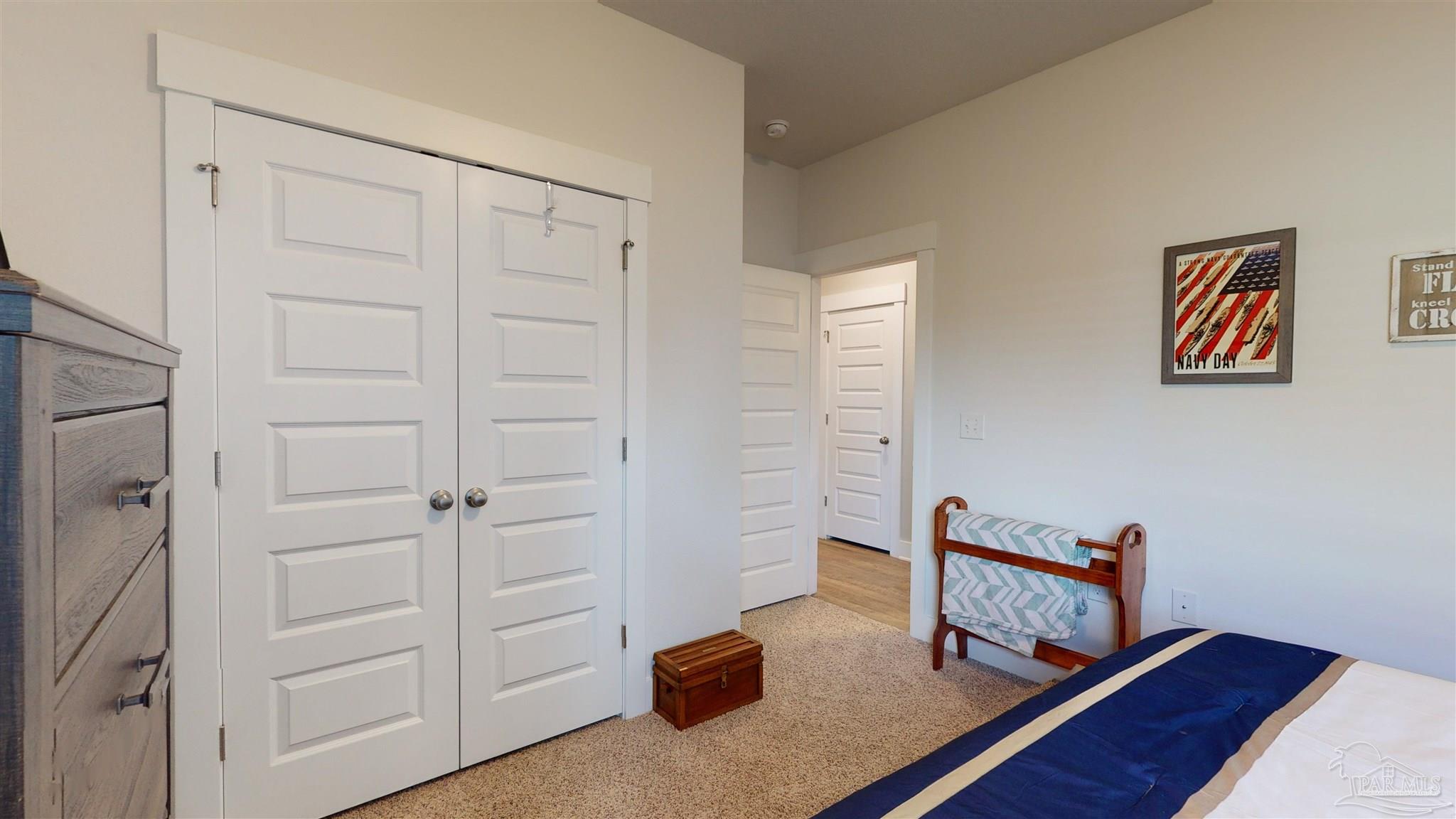 5789 Conley Court Milton, FL 32571 - Photo 35 of 50 a living room with furniture and a wooden floor