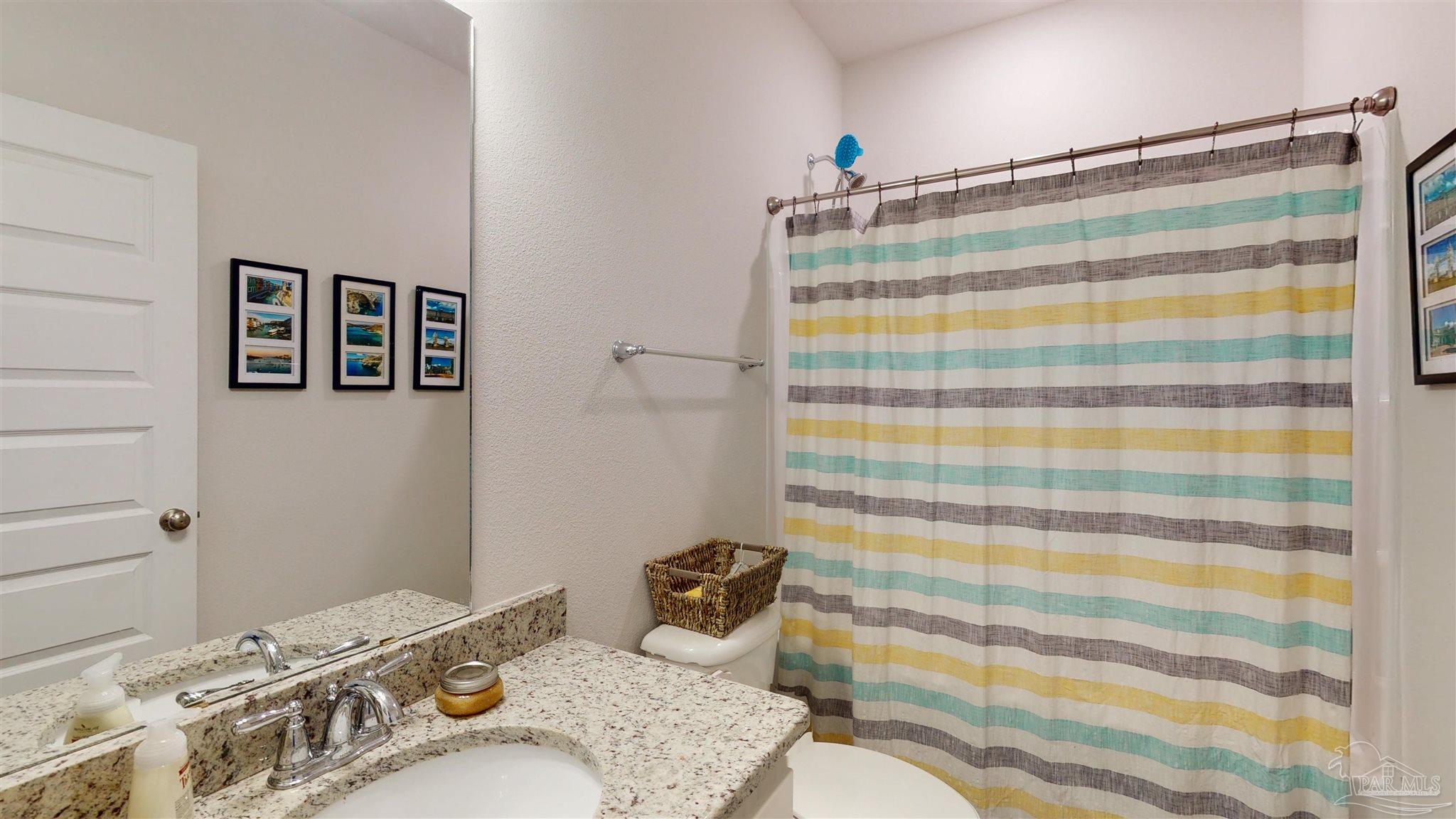 5789 Conley Court Milton, FL 32571 - Photo 36 of 50 a bathroom with a sink and a mirror