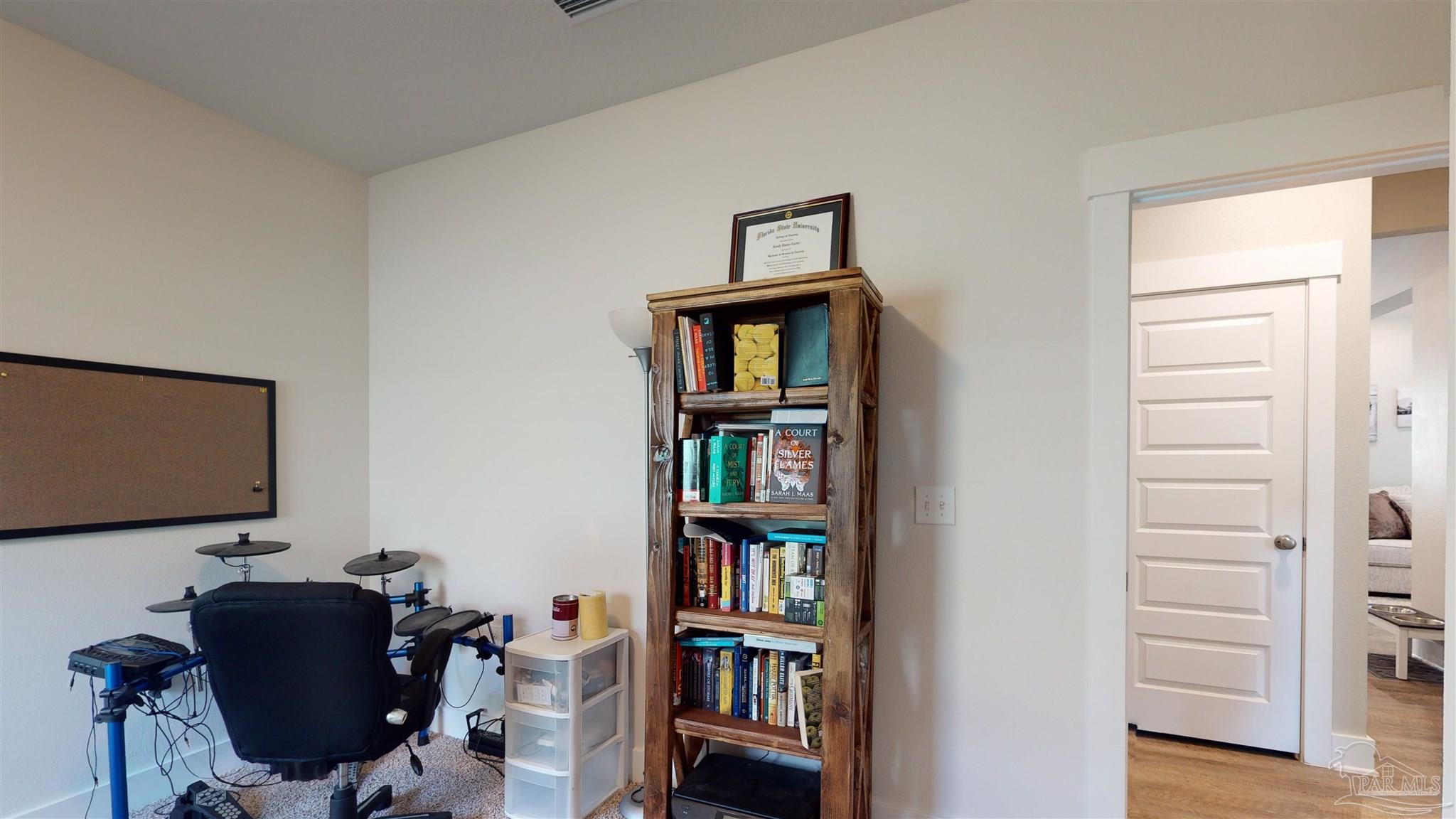 5789 Conley Court Milton, FL 32571 - Photo 39 of 50 a view of a workspace with furniture and cabinet