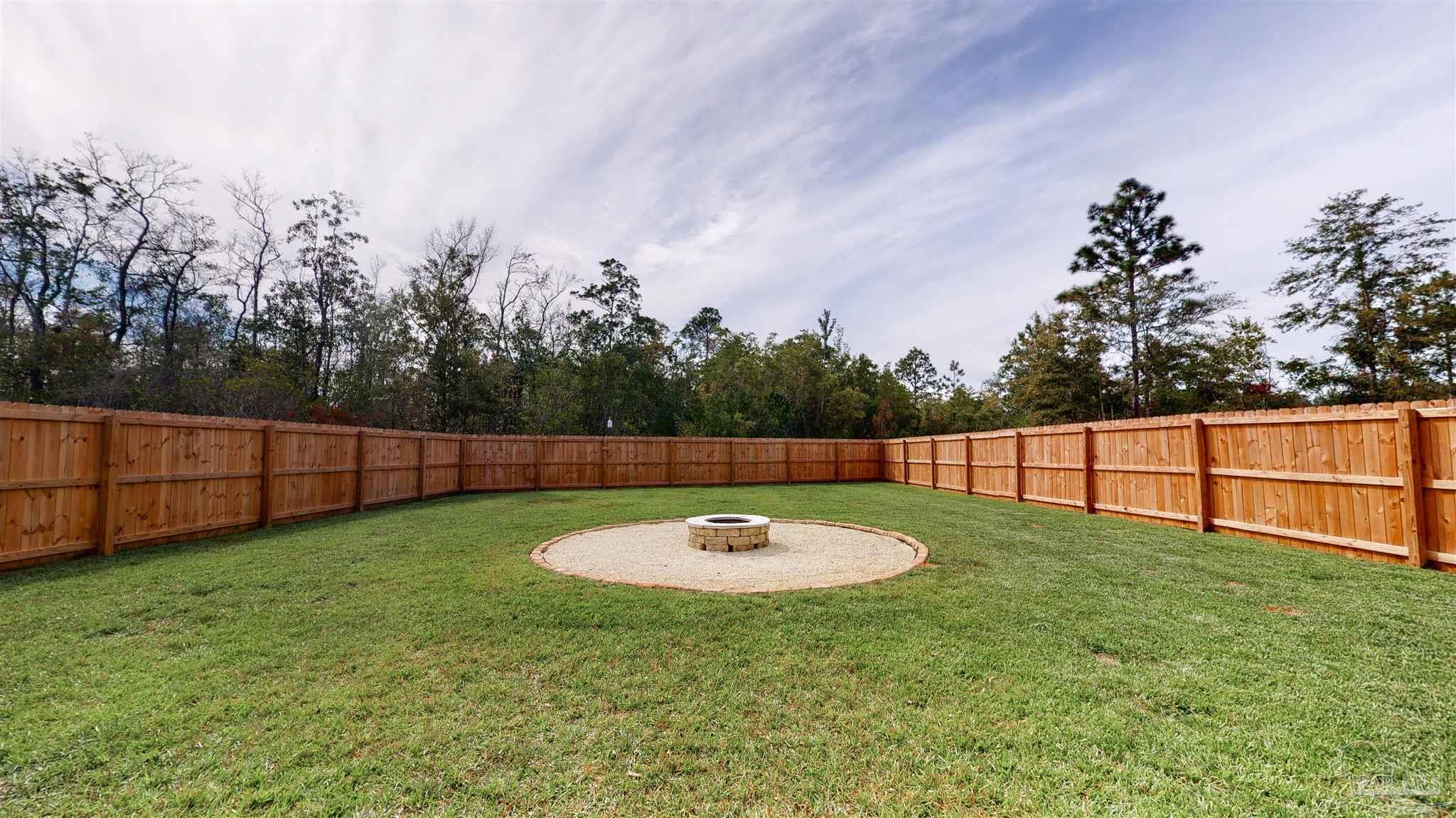 5789 Conley Court Milton, FL 32571 - Photo 44 of 50 a view of a backyard with wooden fence