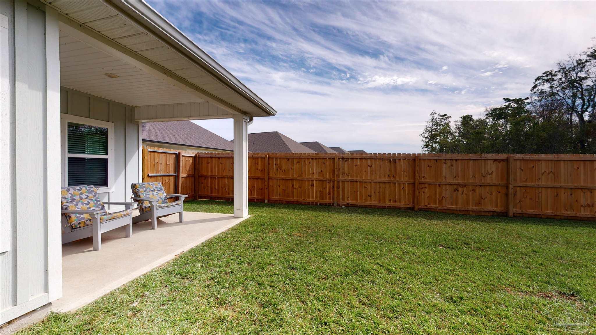 5789 Conley Court Milton, FL 32571 - Photo 45 of 50 a view of a backyard with sitting area