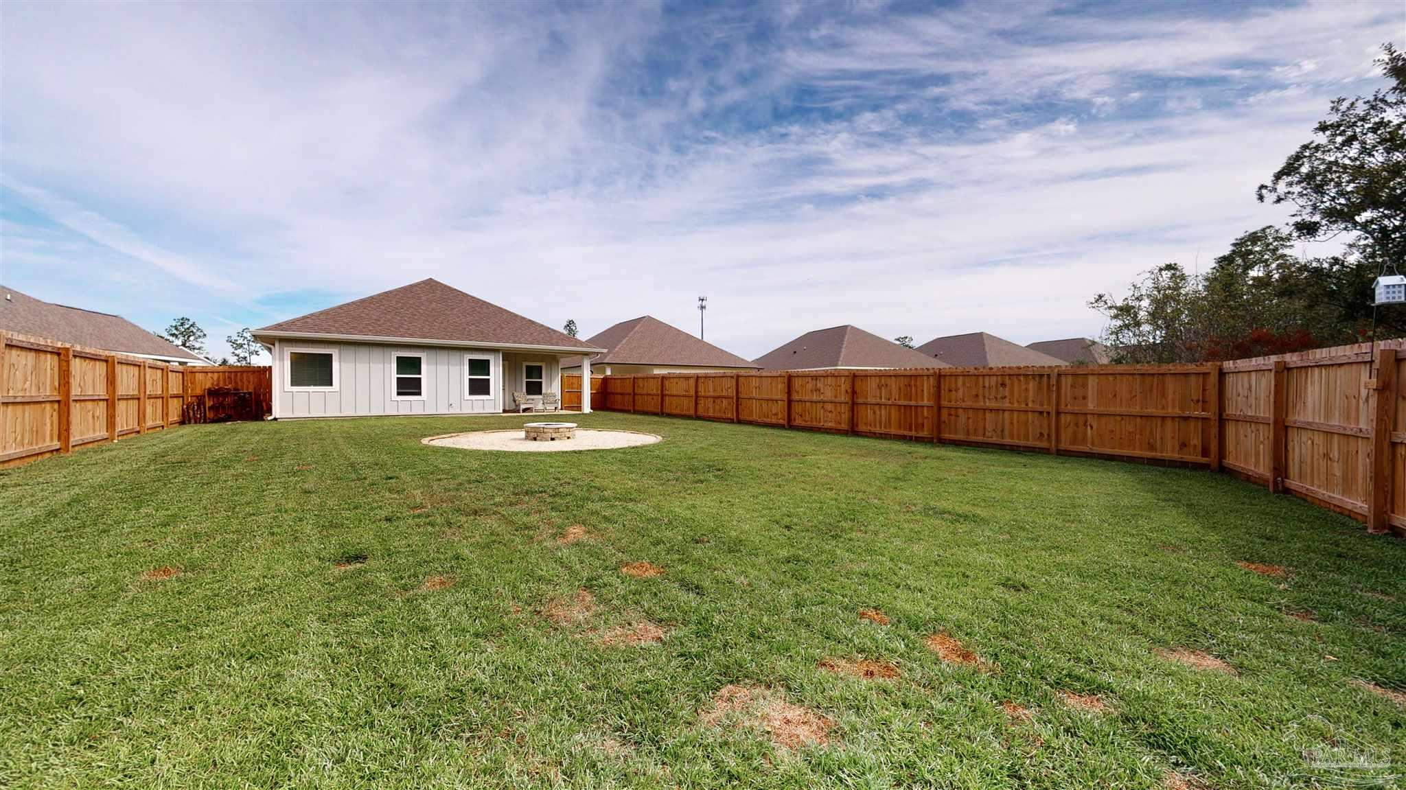 5789 Conley Court Milton, FL 32571 - Photo 47 of 50 a view of a house with backyard and garden