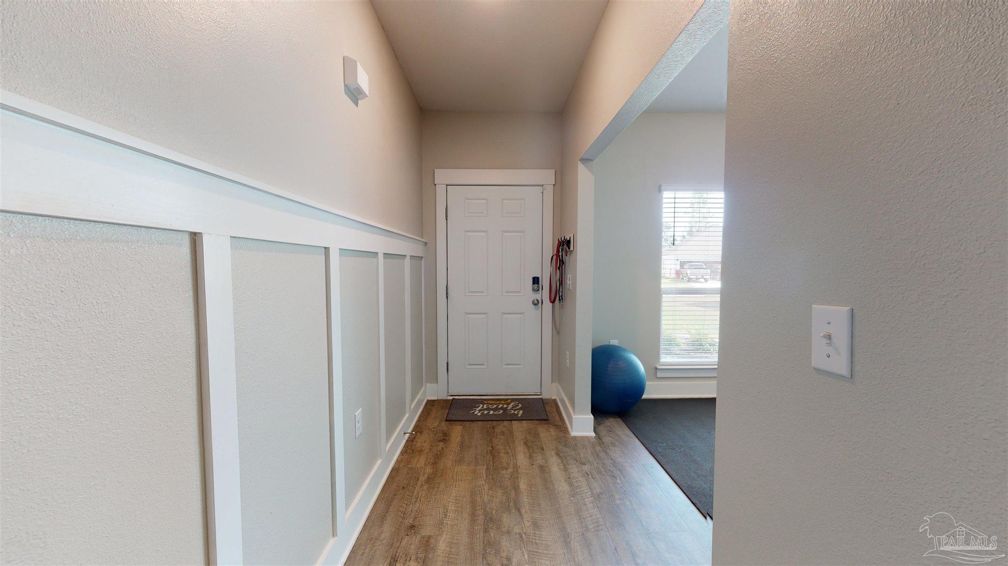 5789 Conley Court Milton, FL 32571 - Photo 7 of 50 a view of hallway with wooden floor