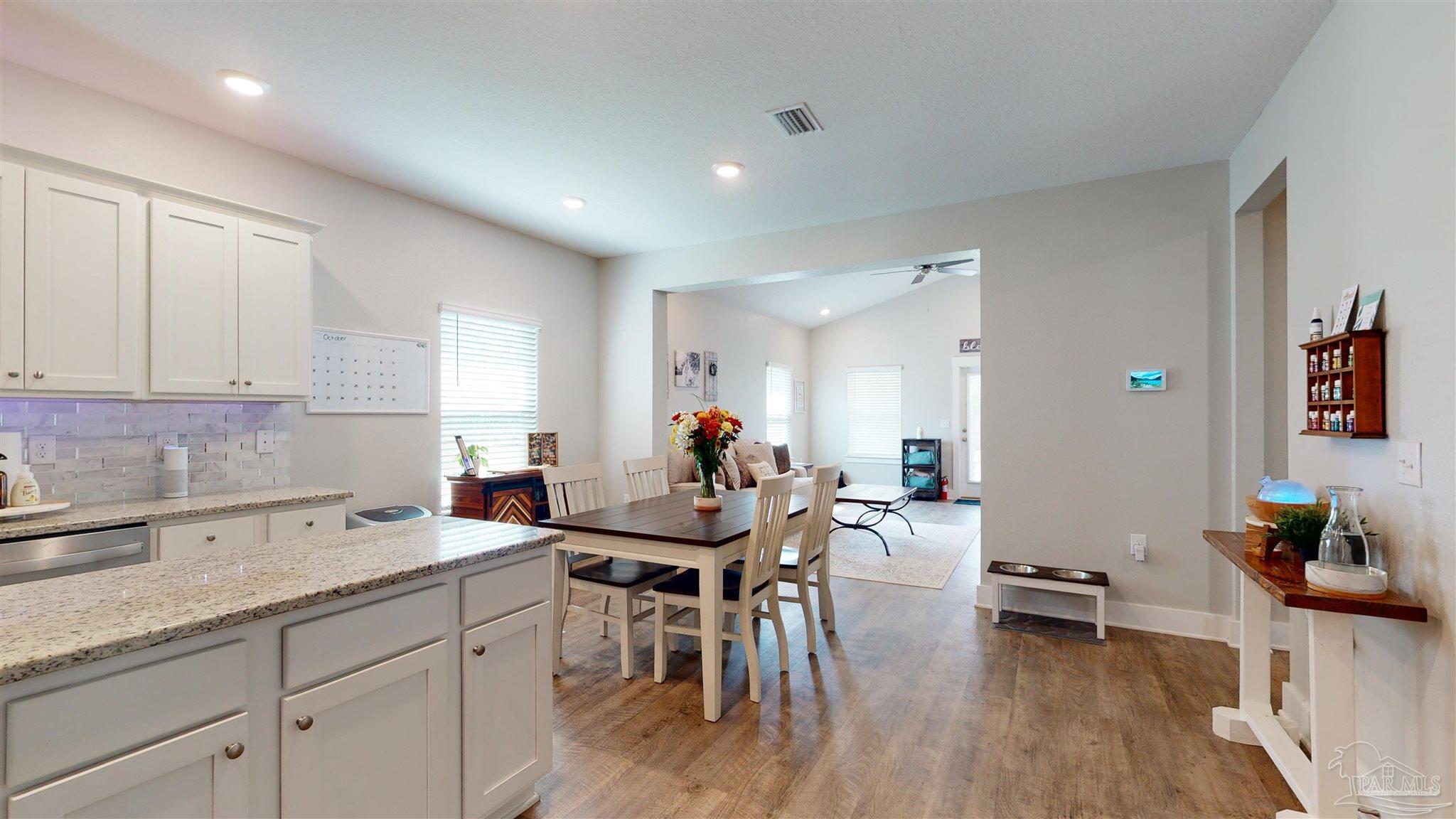 5789 Conley Court Milton, FL 32571 - Photo 8 of 50 a living room with furniture and wooden floor