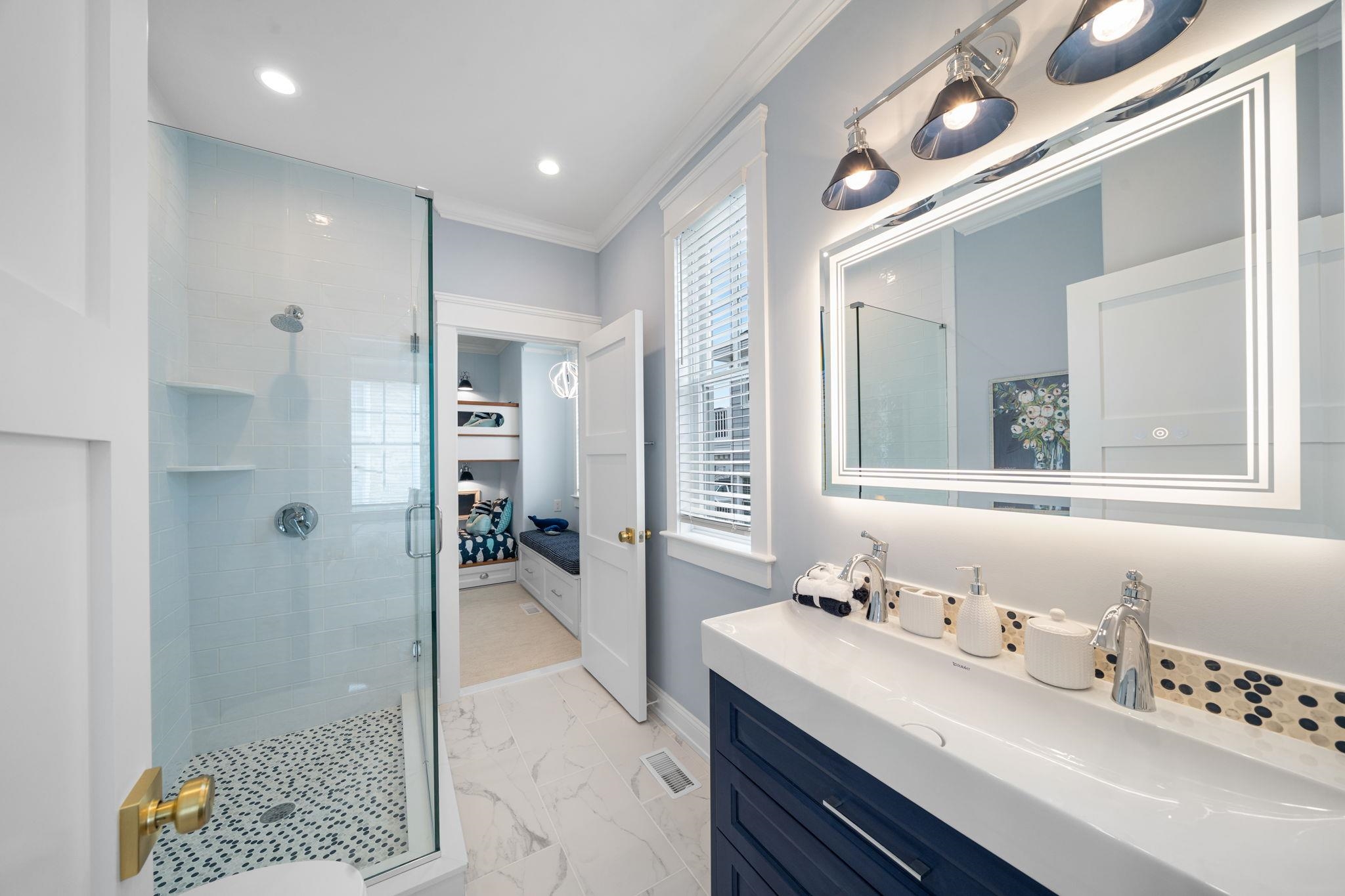 9102 3rd Stone Harbor, NJ 08247 - Photo 18 of 24 a bathroom with a sink double vanity granite tub shower and a mirror