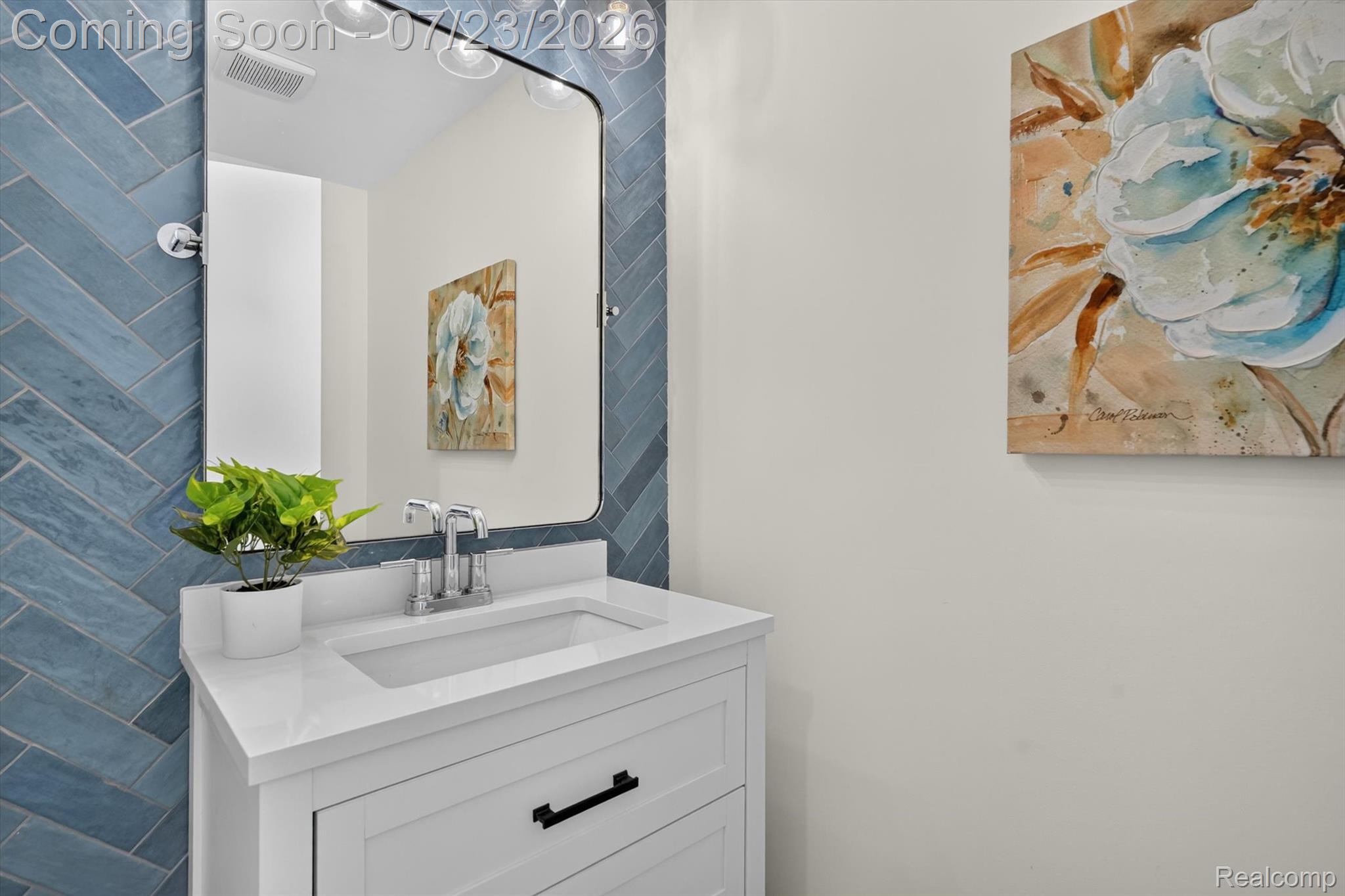 3429 Rolston Road Fenton, MI 48430 - Photo 13 of 62 Vanity with a polished chrome faucet, under-mount sink, and white countertop