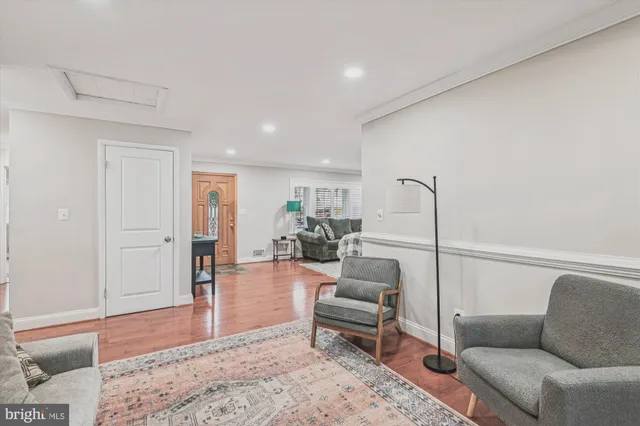 a living room with furniture and a rug
