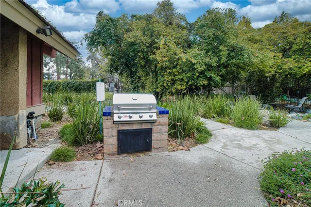 a view of house with outdoor space and garden