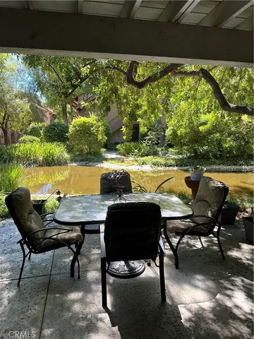 a view of a chairs and table in the patio
