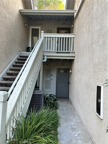 a view of a balcony with chairs
