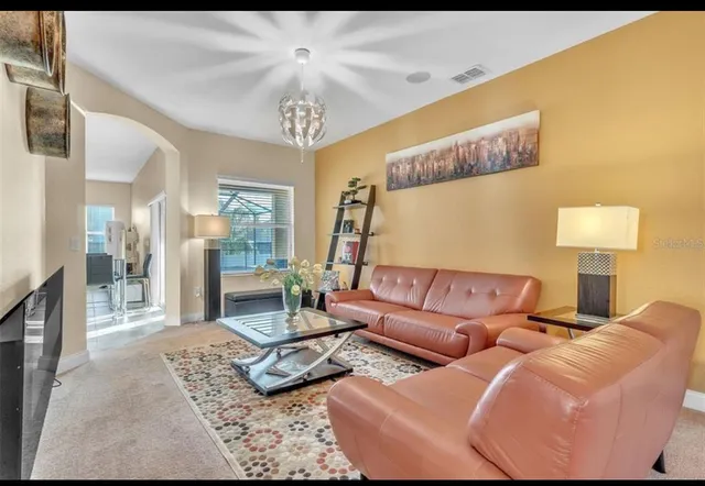 a kitchen with granite countertop a sink stove and refrigerator