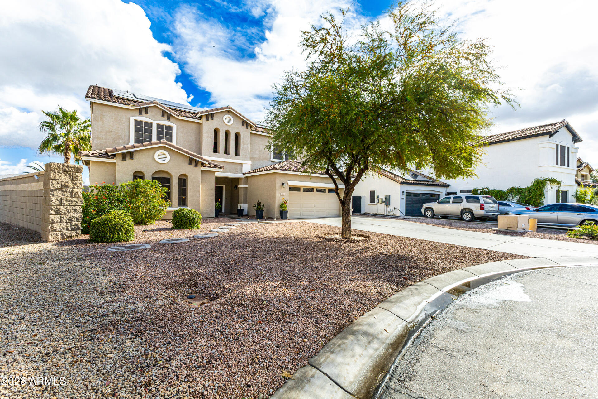 24541 Plum Road Florence, AZ 85132 - Photo 5 of 47 a street view with a building in the background