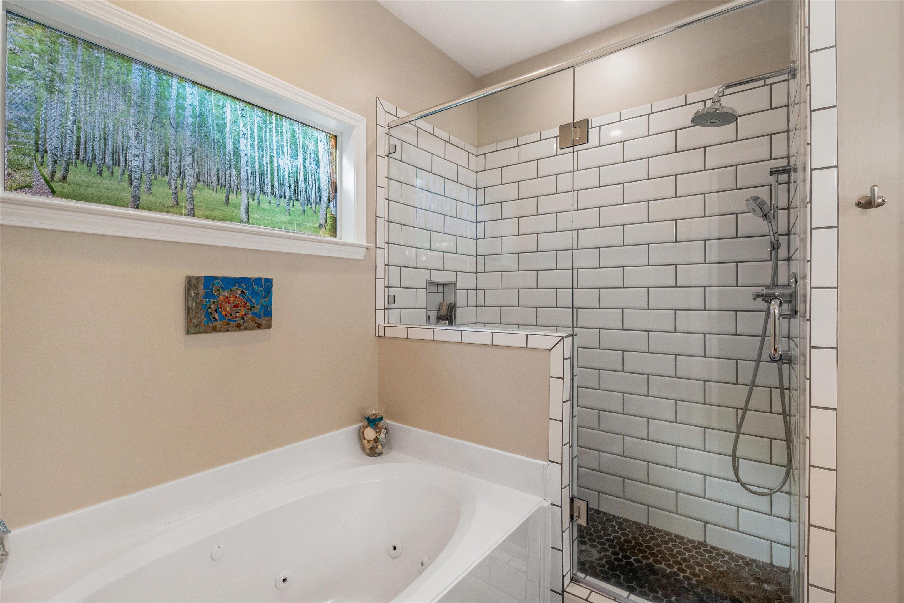 10496 Ashfarm Way Collierville, TN 38017 - Photo 16 of 29 a bathroom with a bathtub and shower