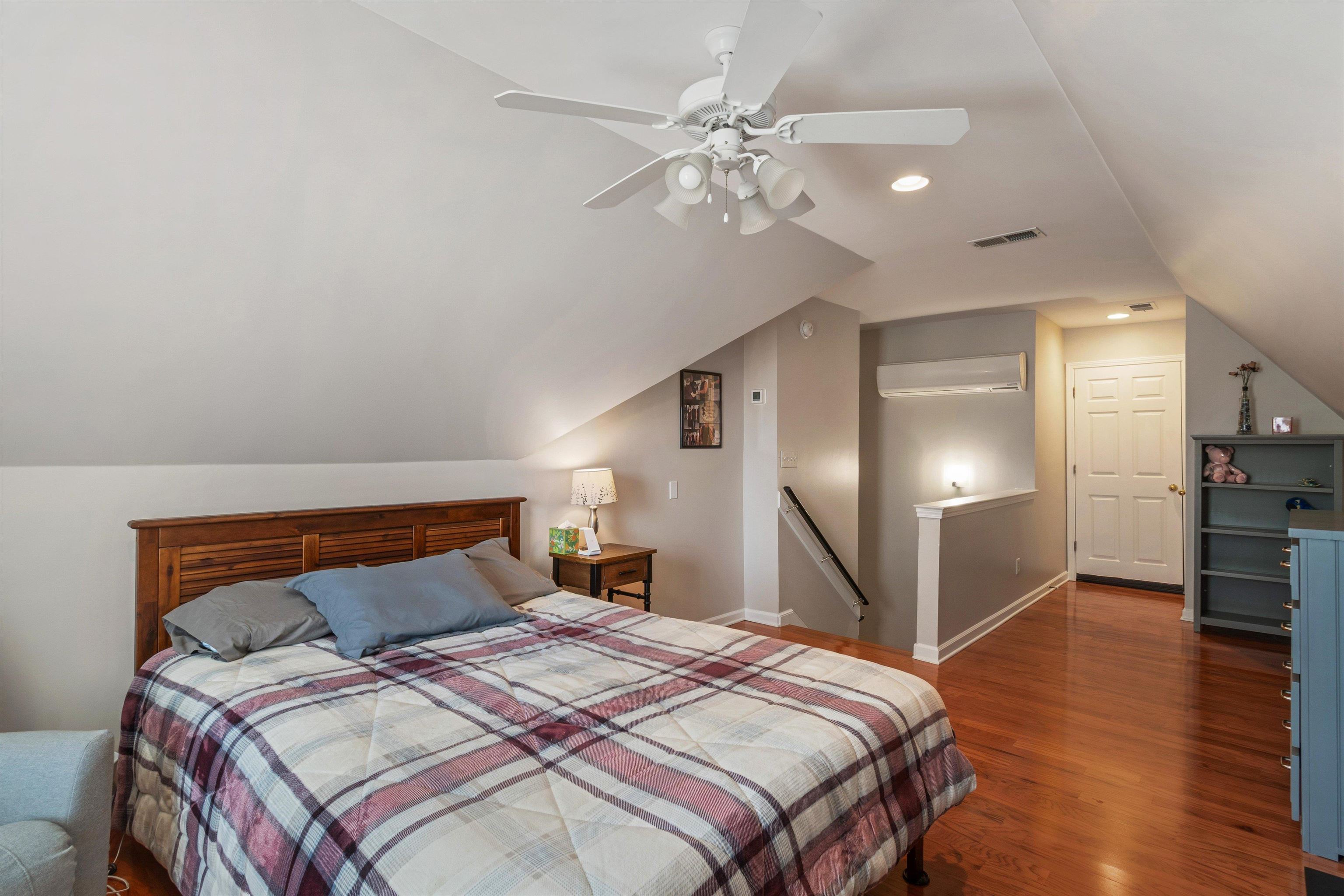 10496 Ashfarm Way Collierville, TN 38017 - Photo 24 of 29 a bedroom with a bed and a chandelier