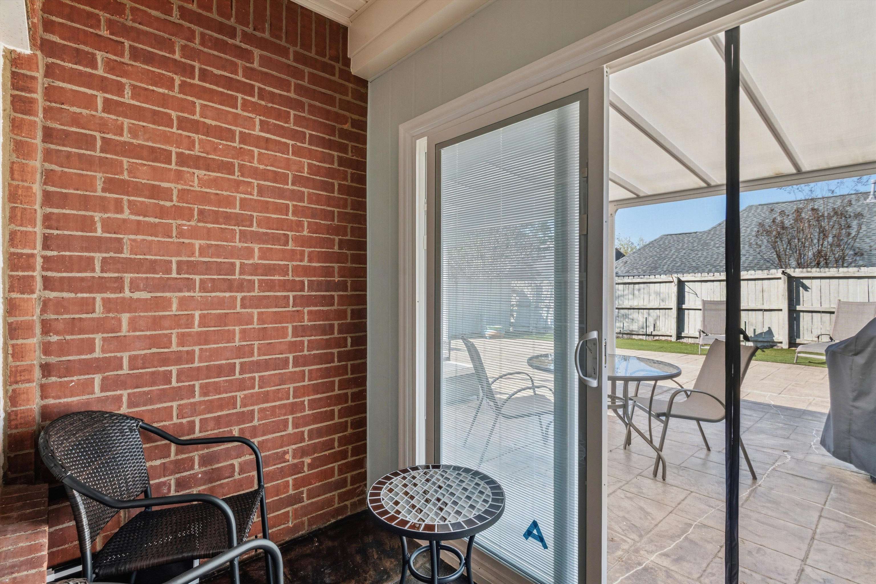 10496 Ashfarm Way Collierville, TN 38017 - Photo 25 of 29 a view of a room with chairs and table in a balcony