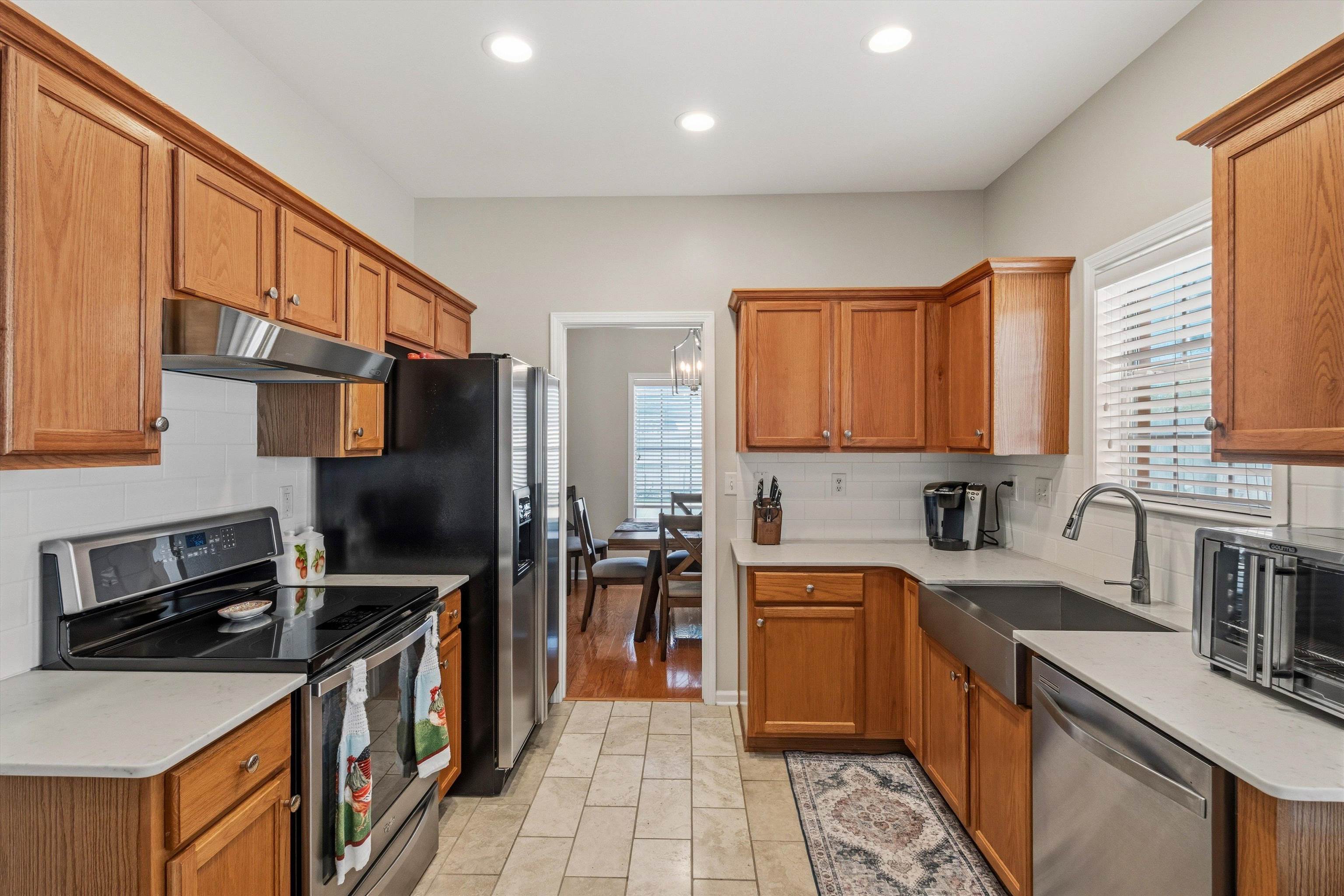 10496 Ashfarm Way Collierville, TN 38017 - Photo 8 of 29 a kitchen with a sink appliances and cabinets