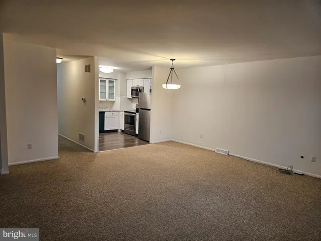 a view of a livingroom and a kitchen
