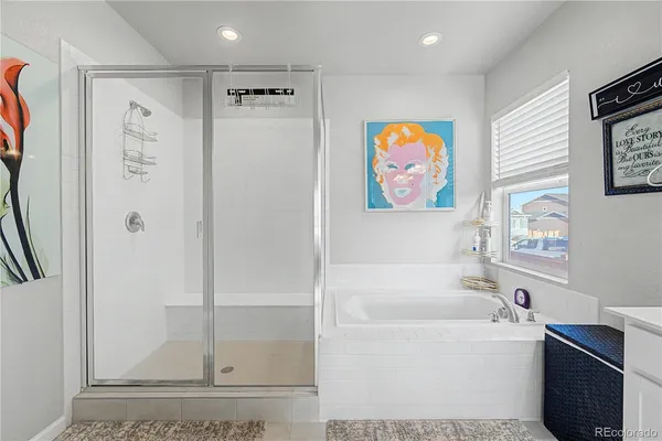 a bathroom with a bathtub and a shower