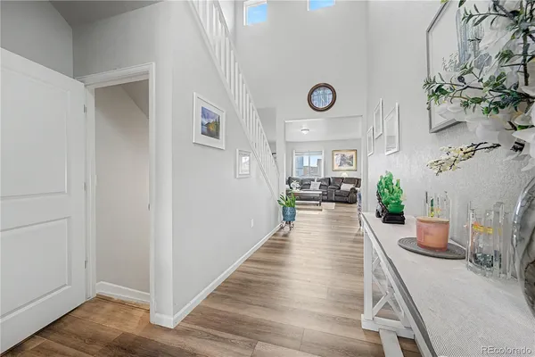 a view of a living room and wooden floor
