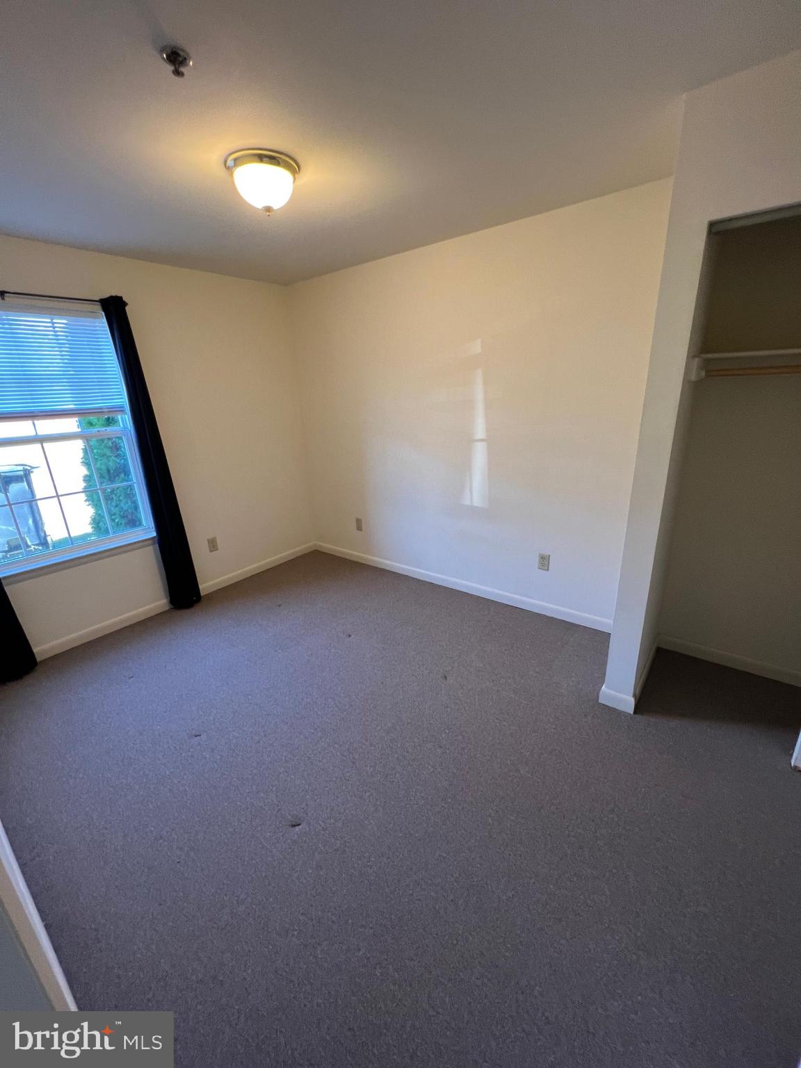 308 Broadway Street, Unit 101 Quantico, VA 22134 - Photo 2 of 6 an empty room with windows